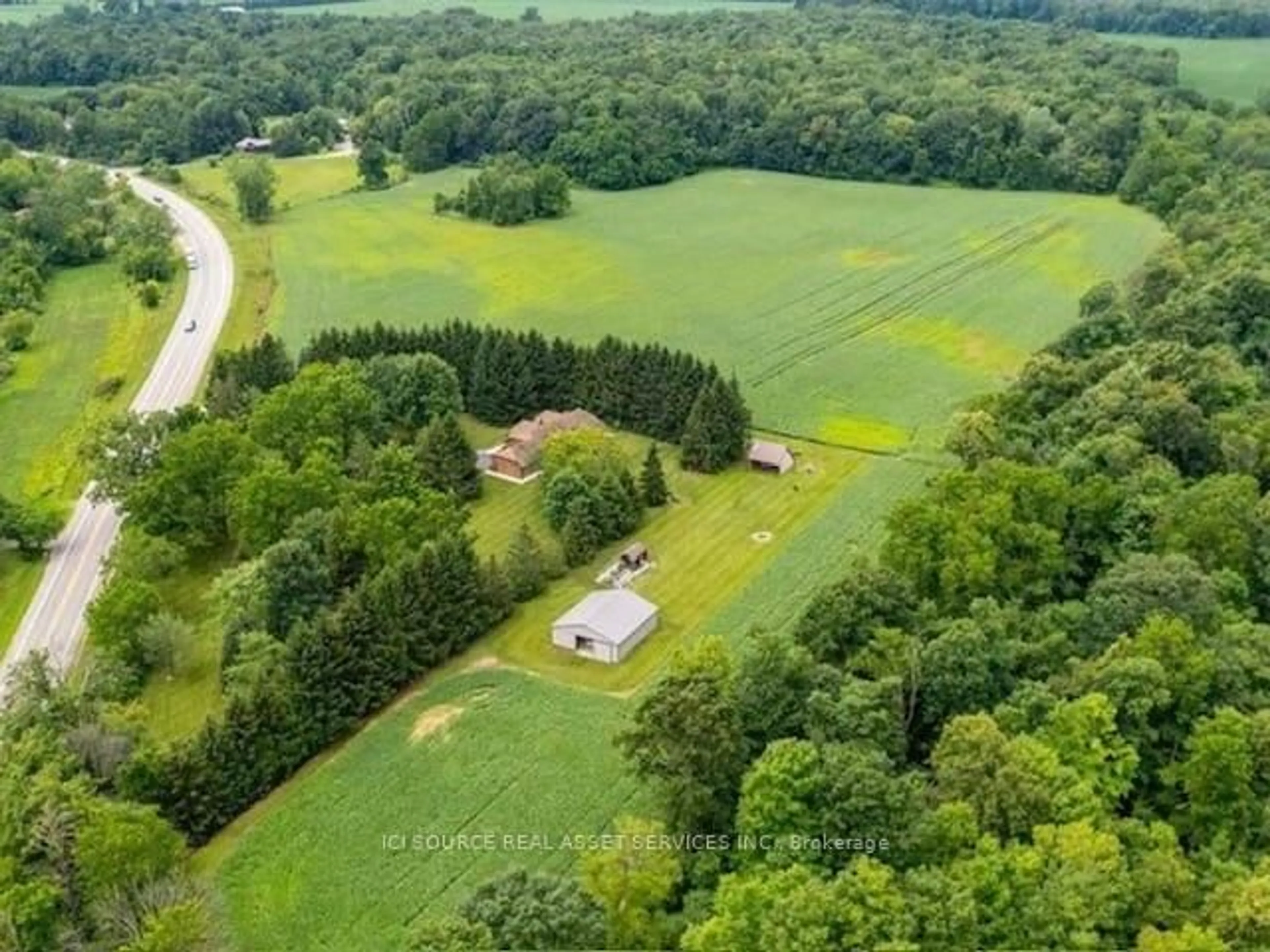 A pic from outside/outdoor area/front of a property/back of a property/a pic from drone, forest/trees view for 1514 Longwoods Rd, Southwest Middlesex Ontario N0L 2N0