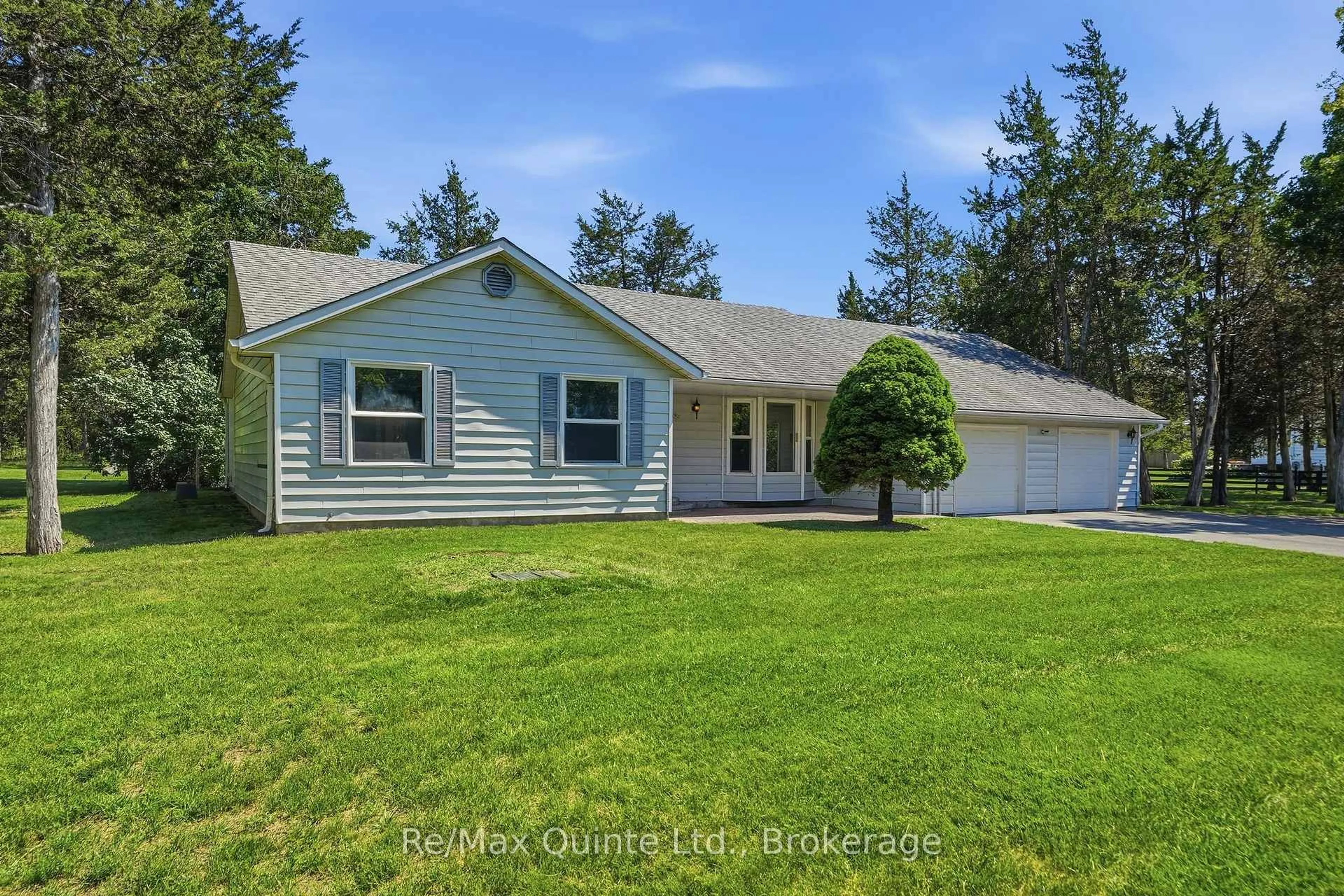 Home with vinyl exterior material, street for 1076 Massassauga Rd, Prince Edward County Ontario K8N 4Z7