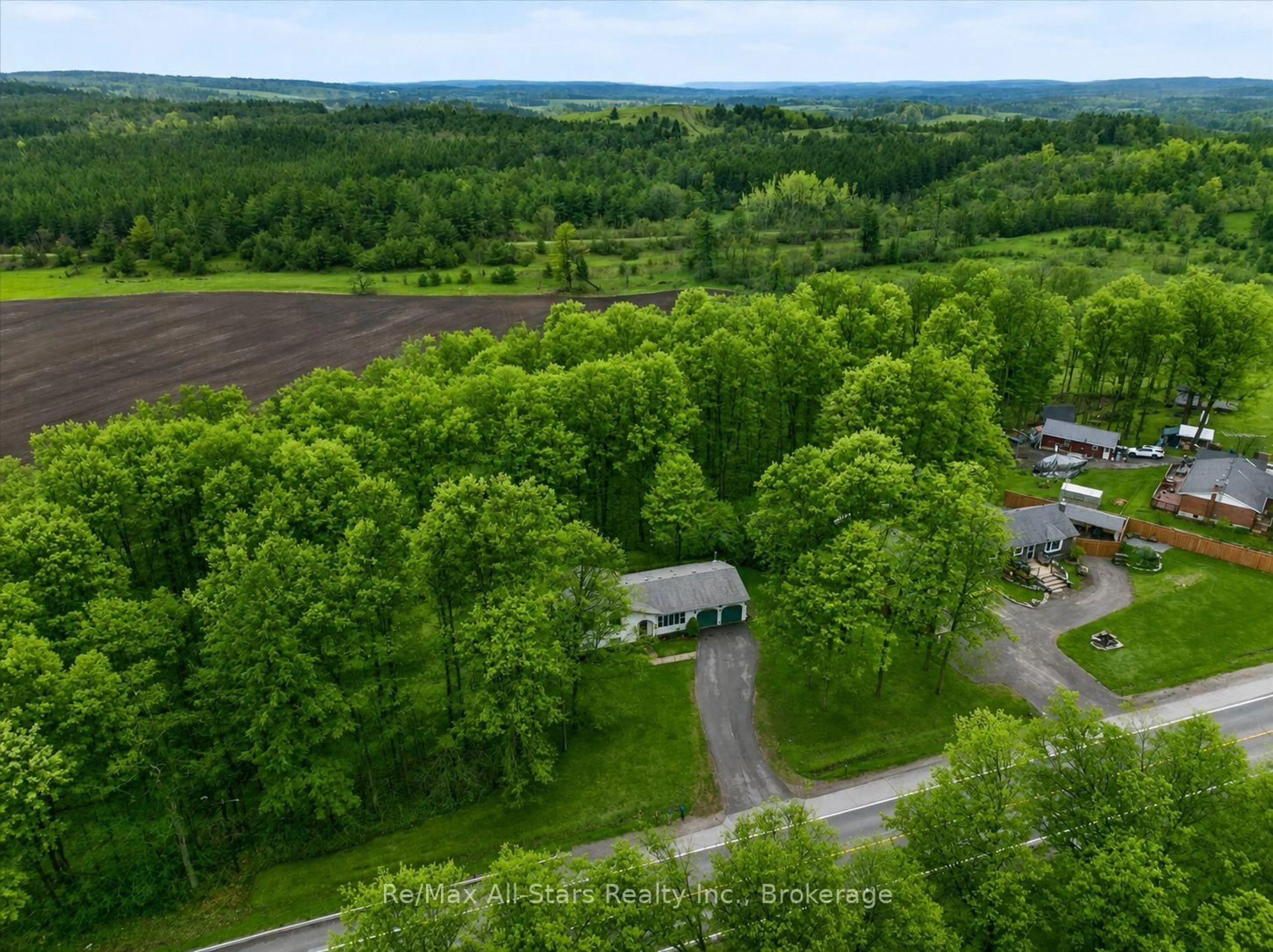A pic from outside/outdoor area/front of a property/back of a property/a pic from drone, forest/trees view for 1558 Highway 7A, Kawartha Lakes Ontario L0A 1A0