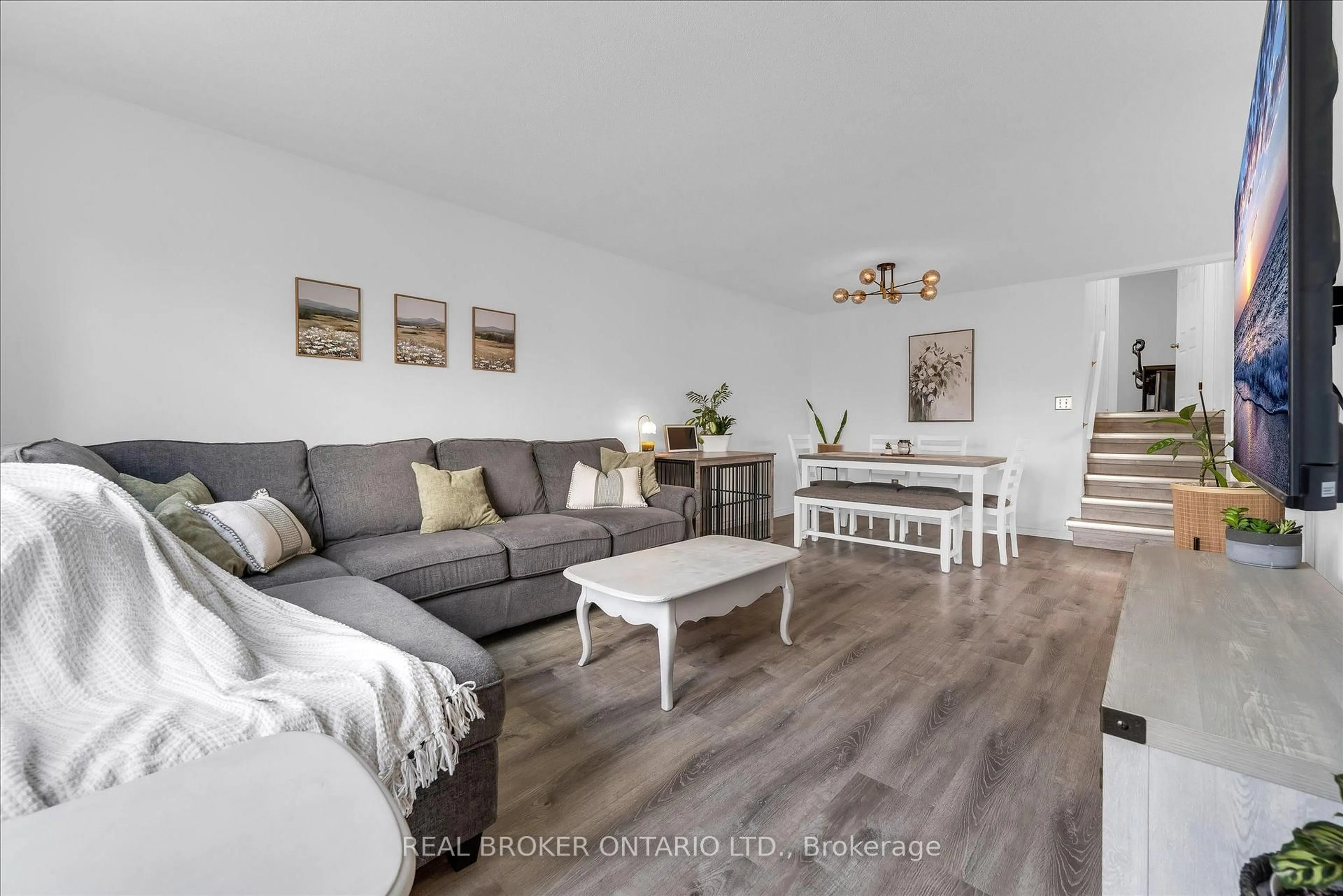 Living room with furniture, wood/laminate floor for 19 Acadia Dr, Welland Ontario L3C 6L4