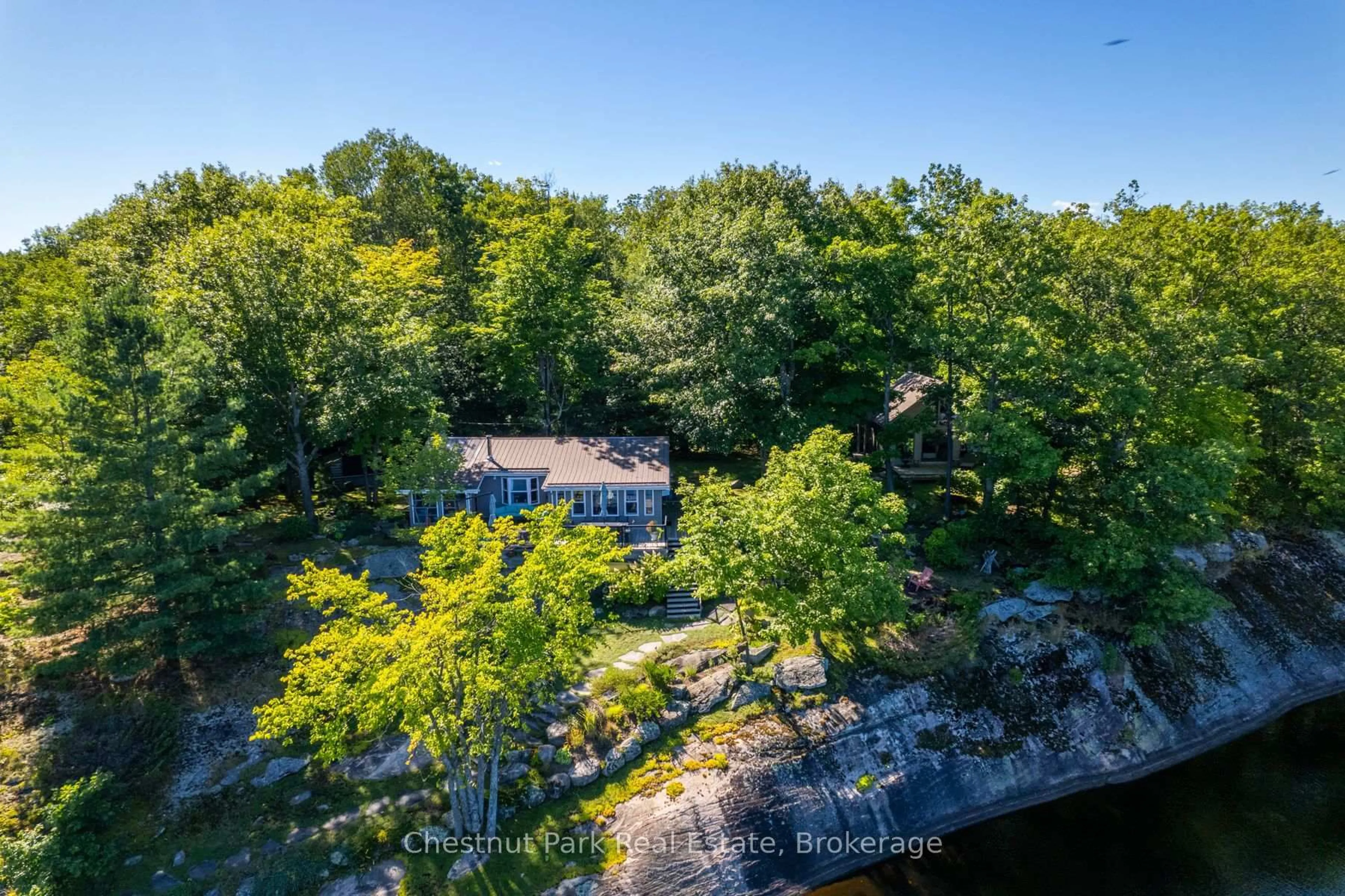 A pic from outside/outdoor area/front of a property/back of a property/a pic from drone, forest/trees view for 179 Haggart Lake Rd, Georgian Bay Ontario P0C 1H0