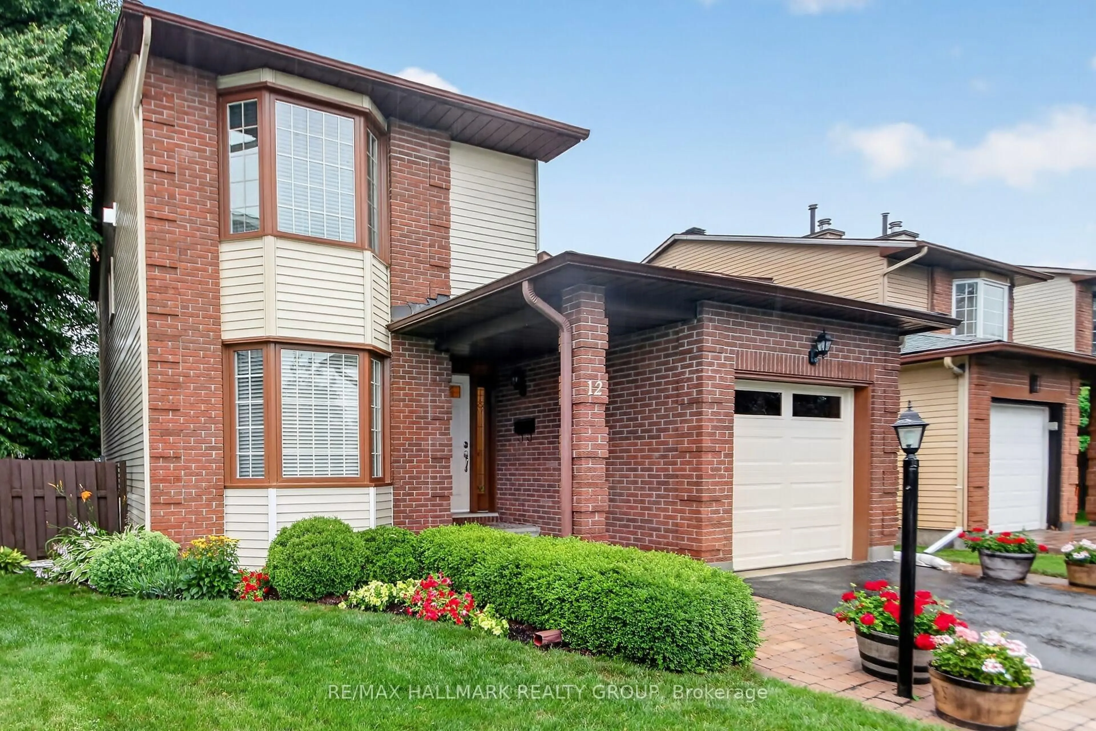 Home with brick exterior material, street for 12 Ready Way, Ottawa Ontario K2J 2R6