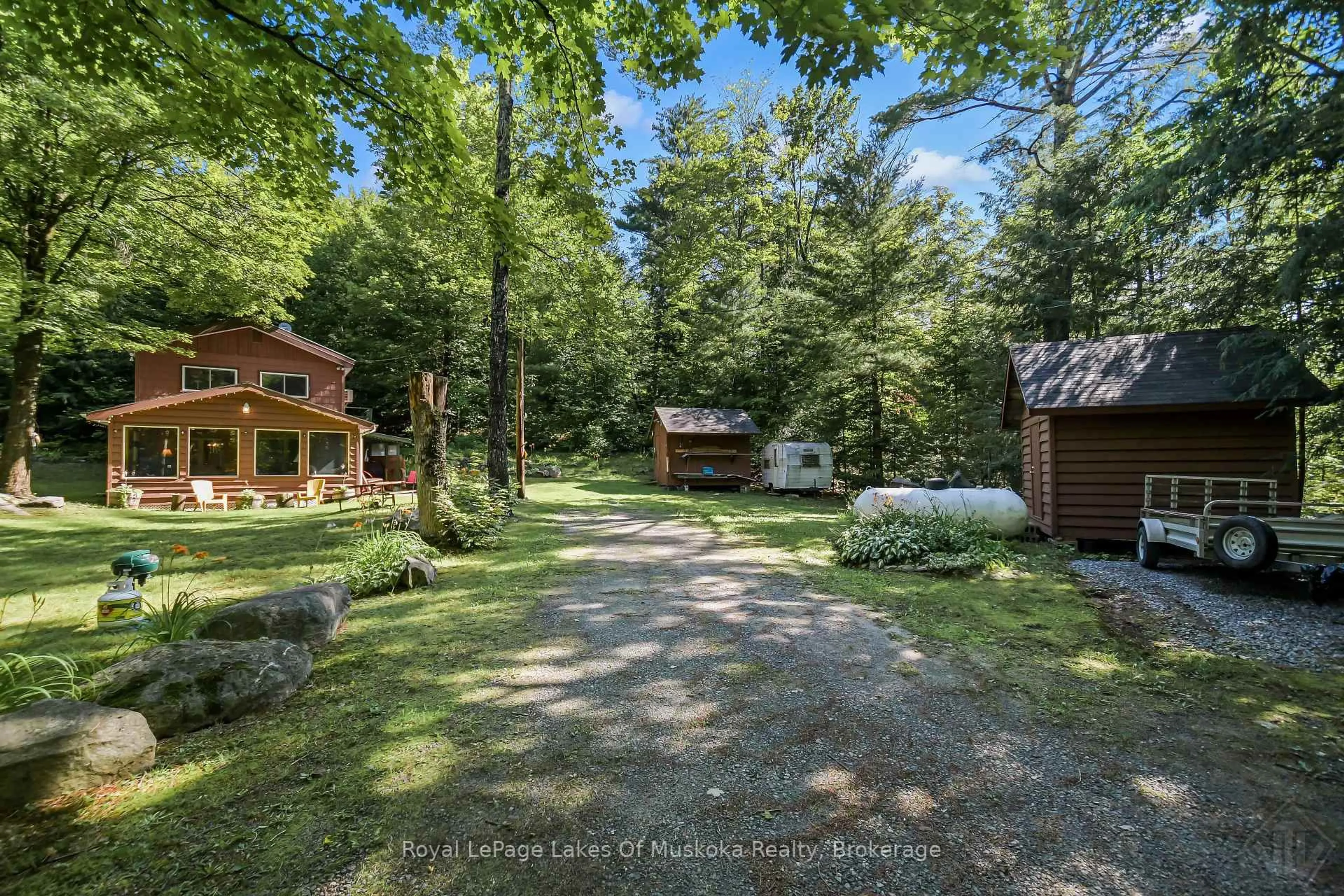 A pic from outside/outdoor area/front of a property/back of a property/a pic from drone, forest/trees view for 1009 Andersen Rd, Bracebridge Ontario P1L 1X1