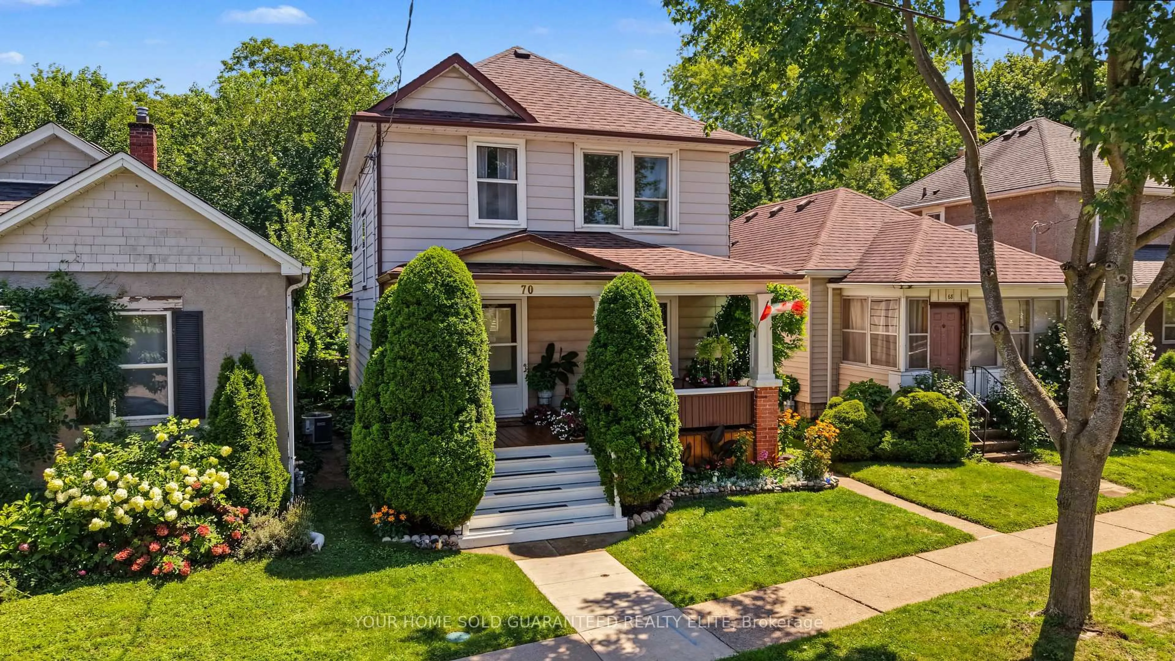 Home with brick exterior material, street for 70 Woodland Ave, St. Catharines Ontario L2R 5A3