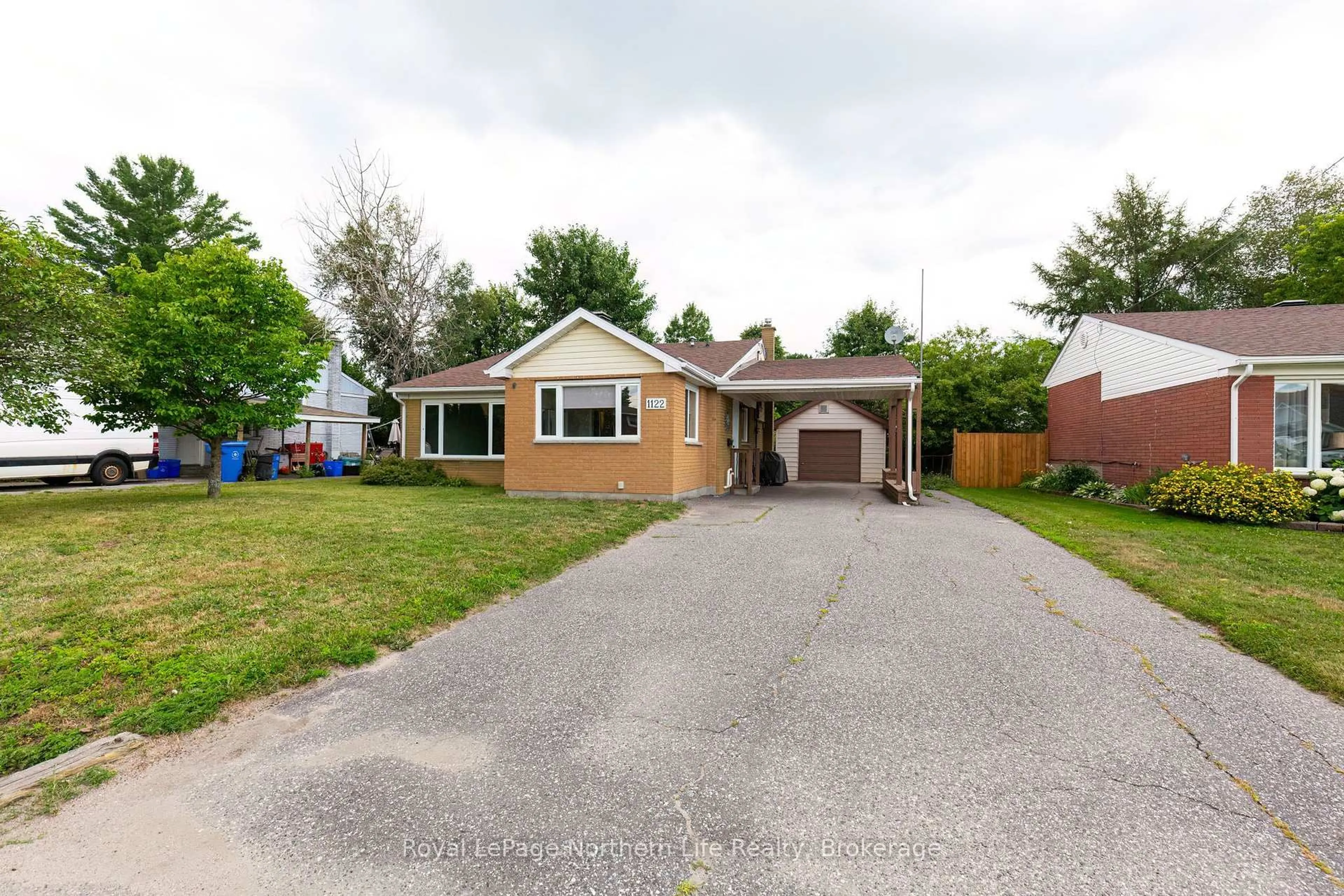 Home with brick exterior material, street for 1122 Athlone St, North Bay Ontario P1B 5C1