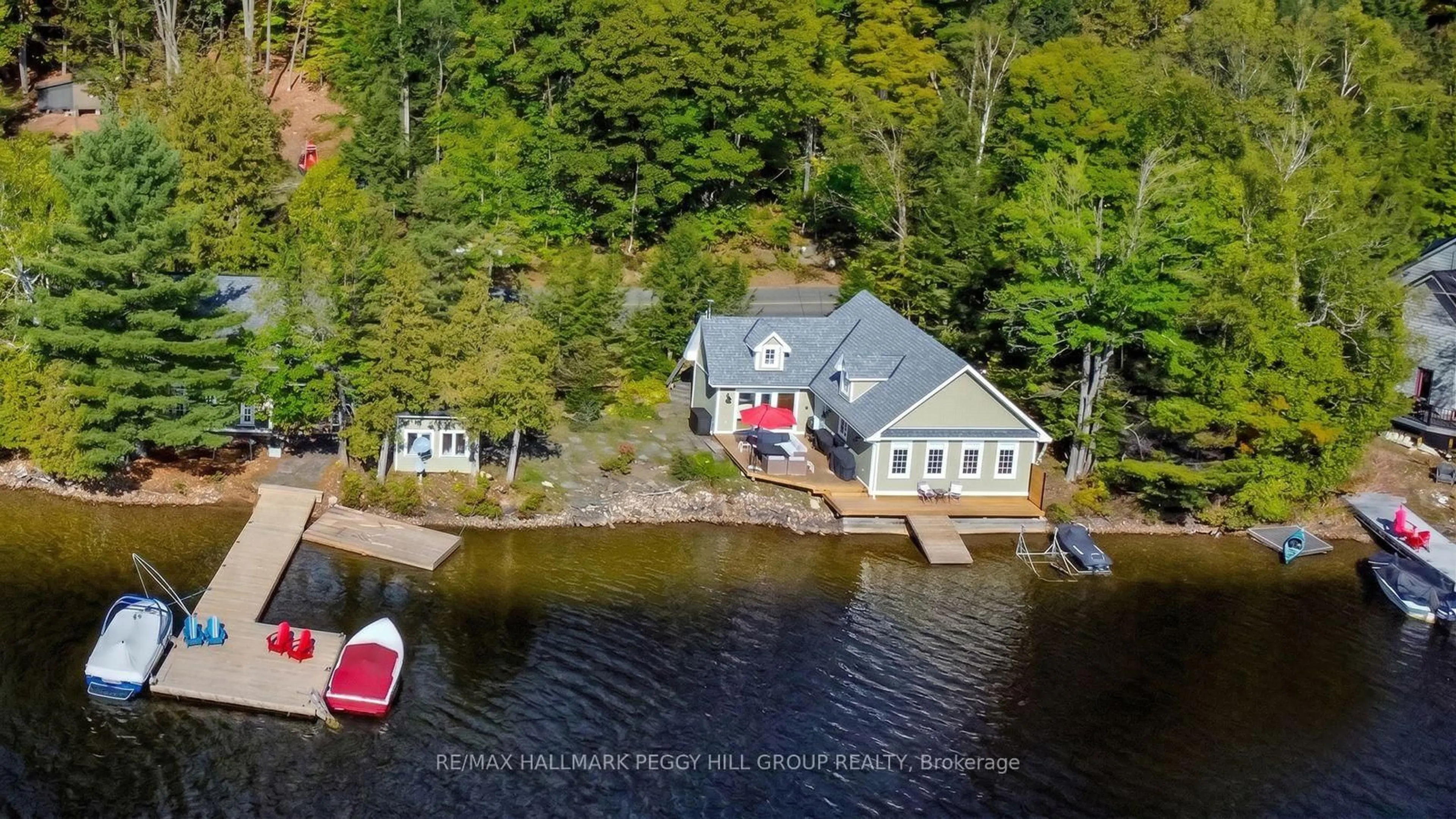 A pic from outside/outdoor area/front of a property/back of a property/a pic from drone, water/lake/river/ocean view for 3978 South Portage Rd, Huntsville Ontario P1H 2J3