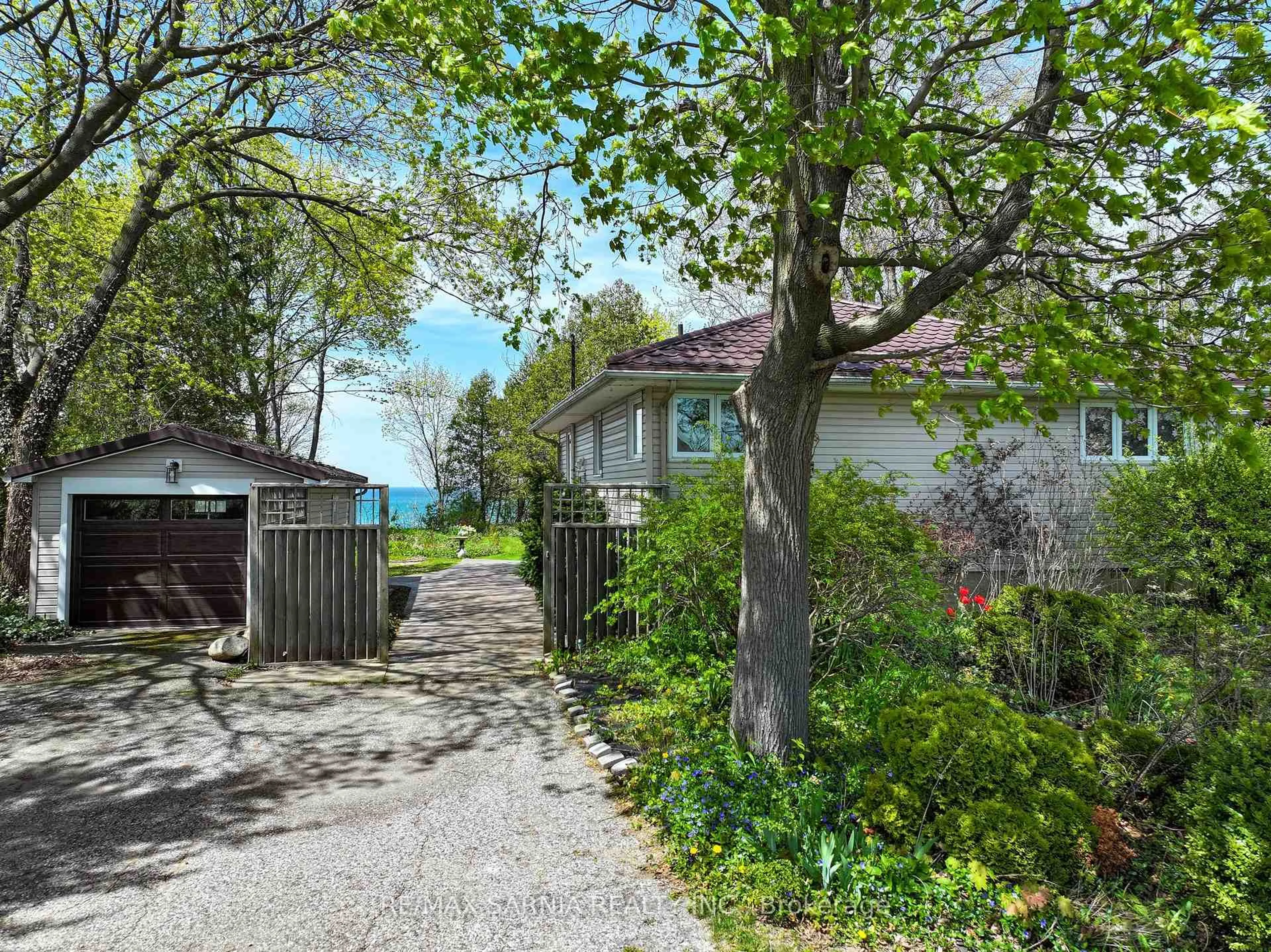 A pic from outside/outdoor area/front of a property/back of a property/a pic from drone, street for 4660 Lakeside St, Plympton-Wyoming Ontario N0N 1J6