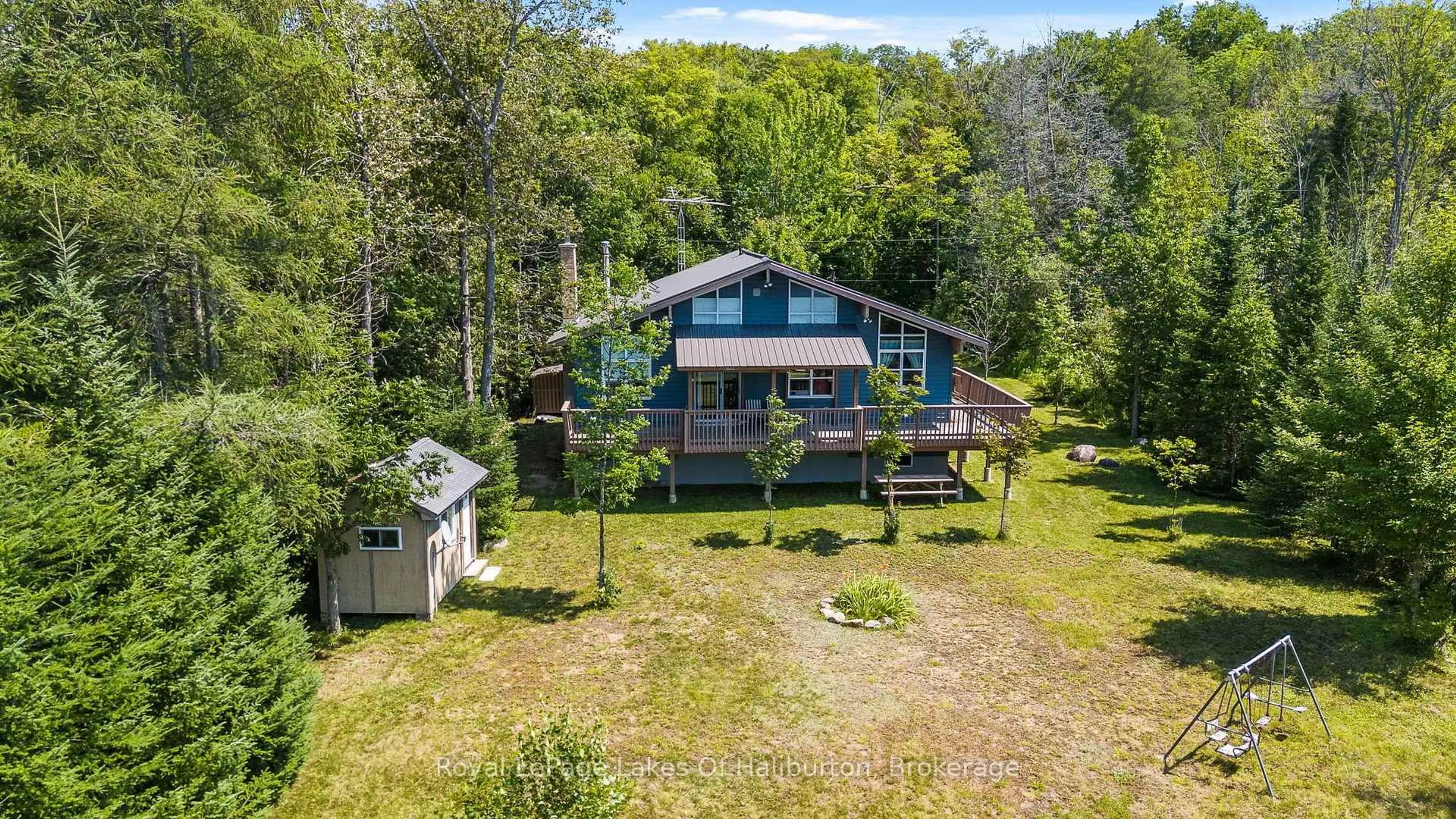 A pic from outside/outdoor area/front of a property/back of a property/a pic from drone, water/lake/river/ocean view for 1020 Granite Lane, Highlands East Ontario K0M 1R0