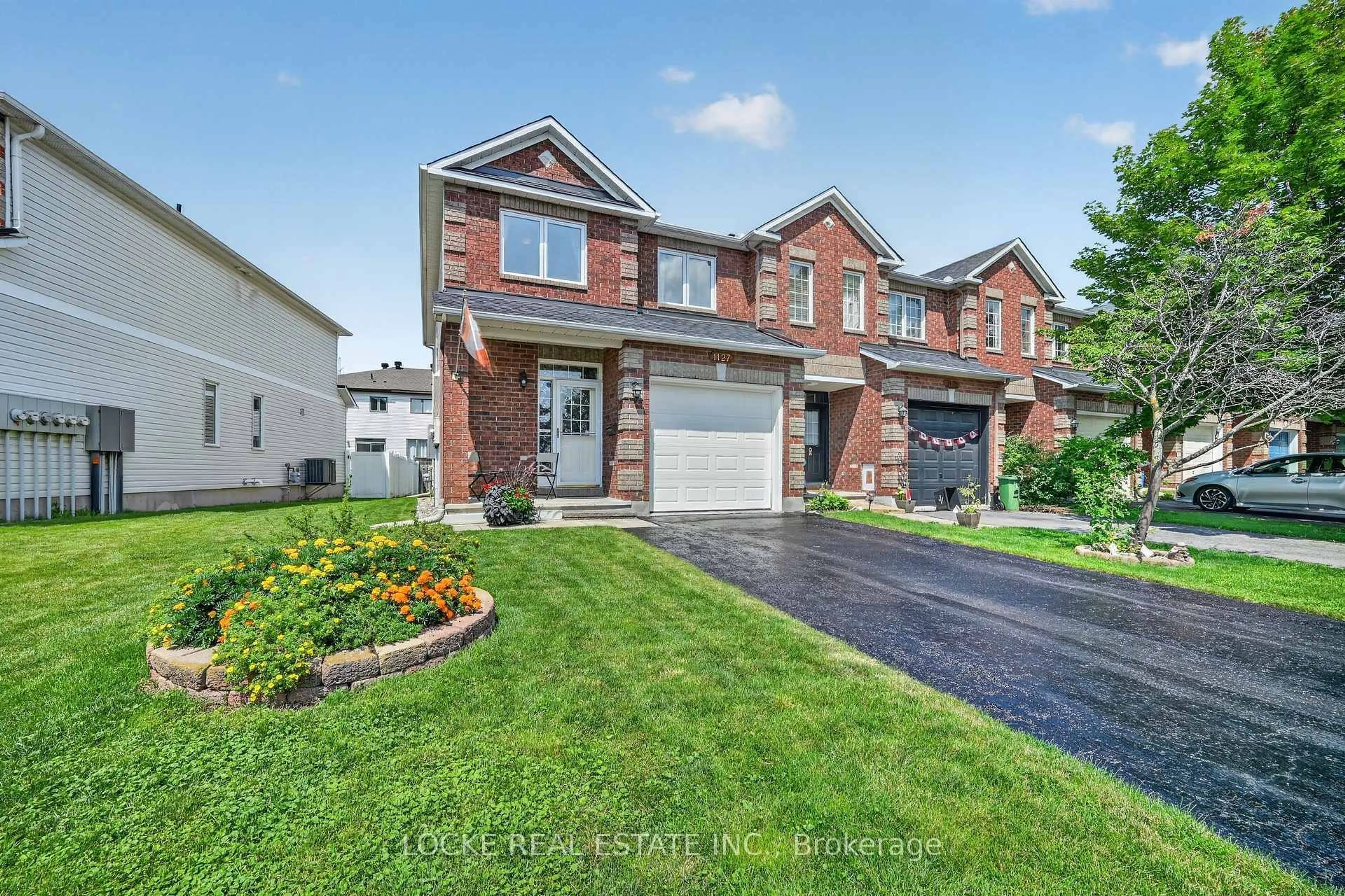 Home with brick exterior material, street for 1127 Brasseur Cres, Orleans Ontario K4A 5A2