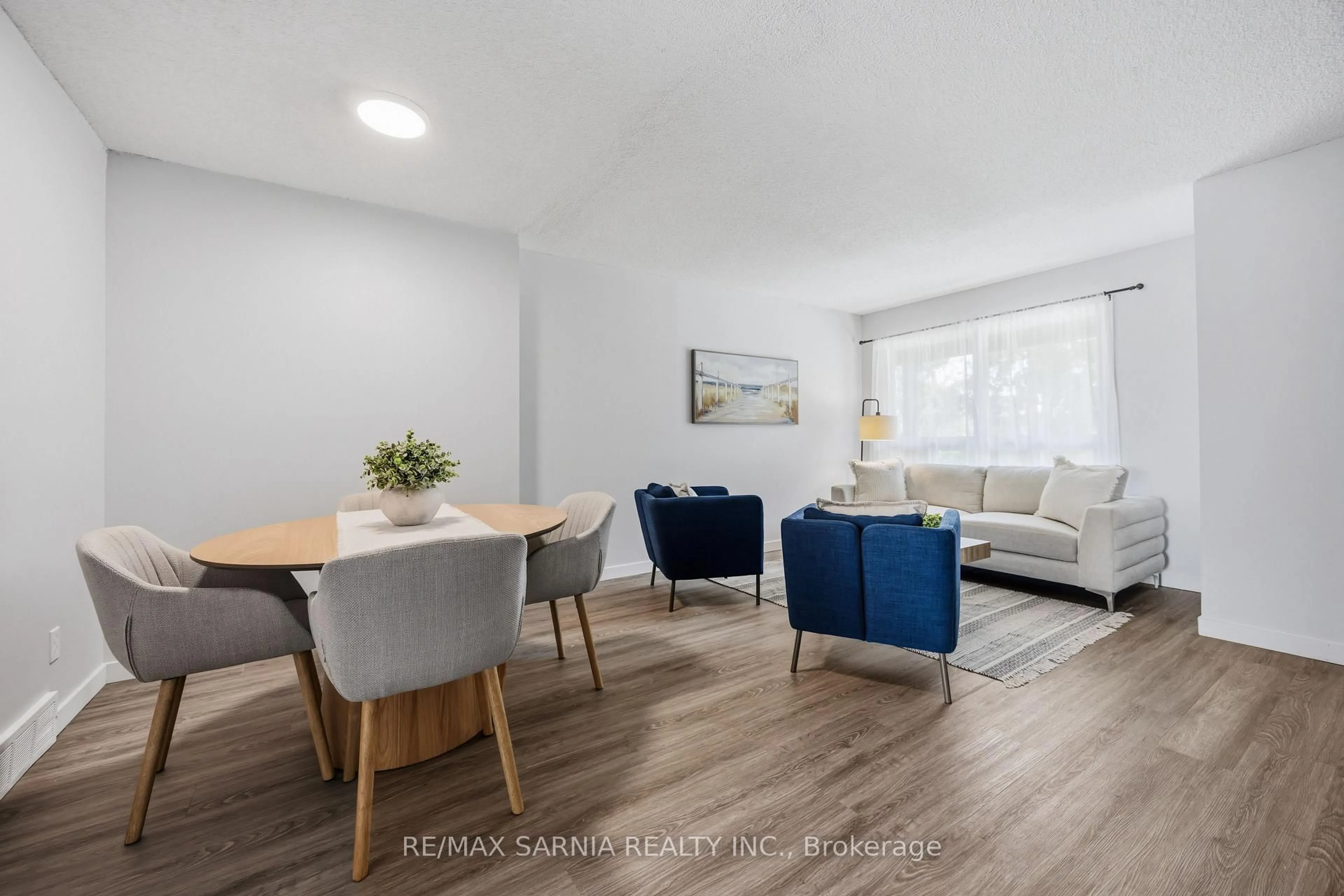 Living room with furniture, wood/laminate floor for 200 St Clair Blvd #5, St. Clair Ontario N0N 1G0