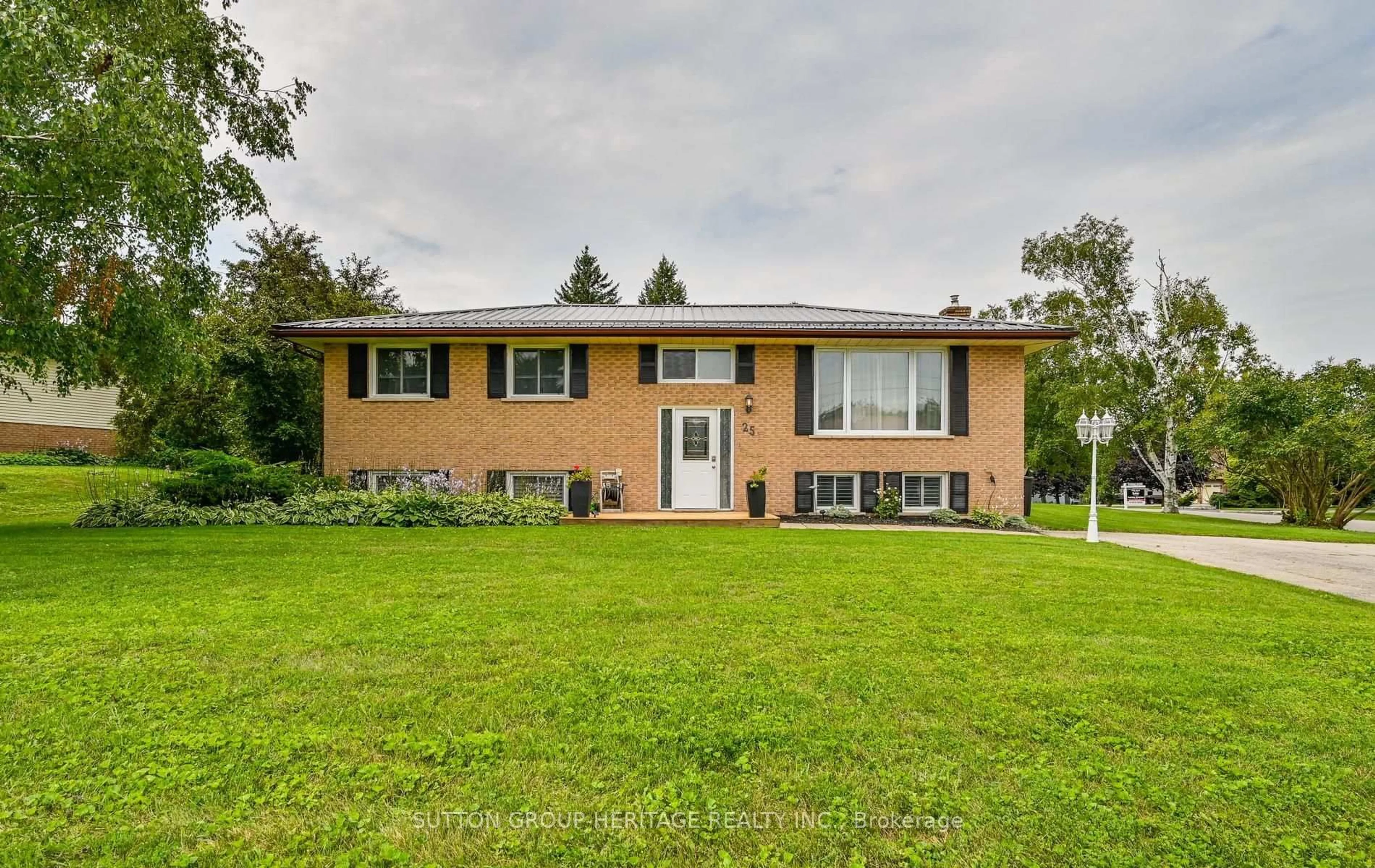 Home with brick exterior material, street for 25 Manvers Dr, Kawartha Lakes Ontario L0B 1K0