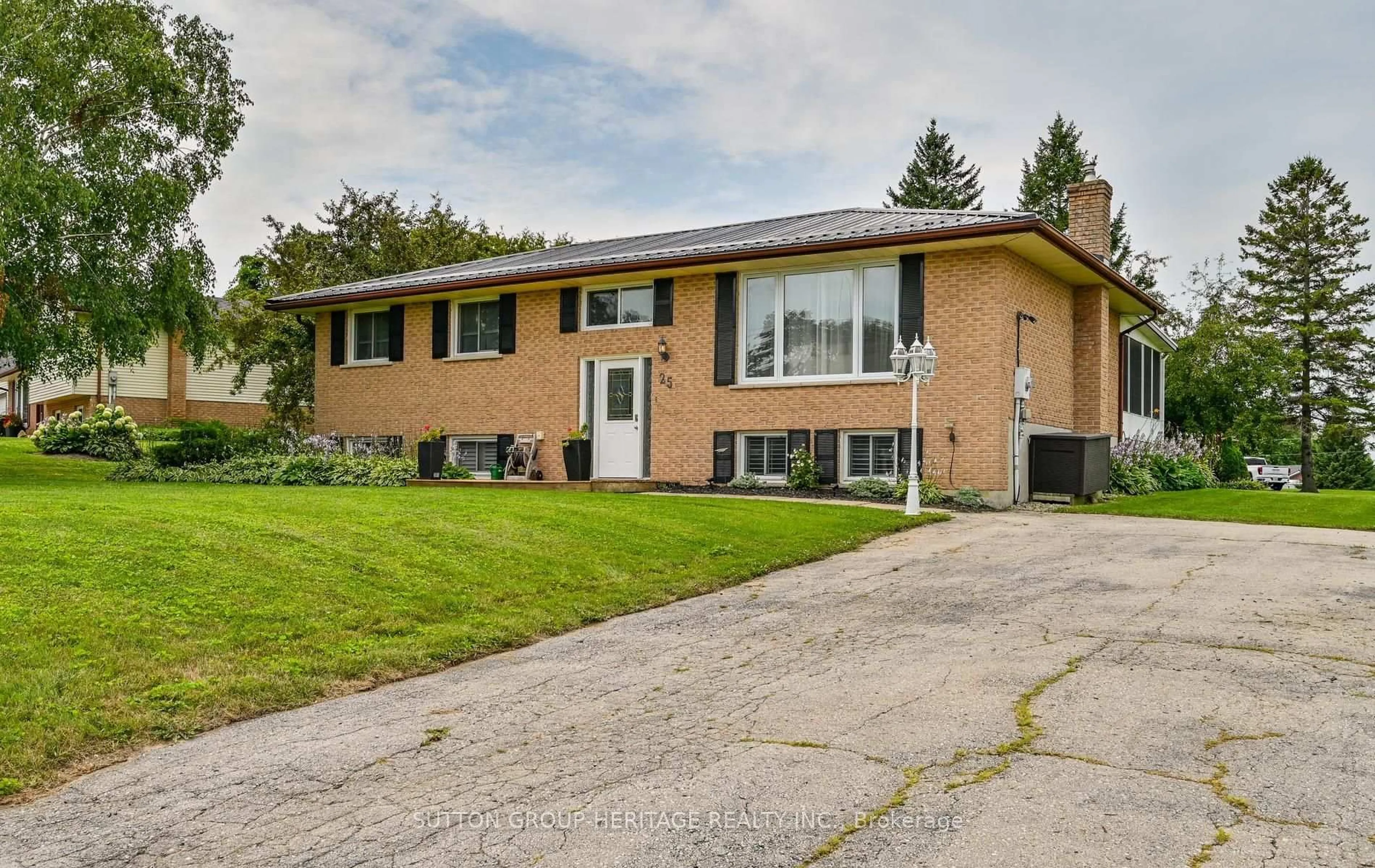 Home with brick exterior material, street for 25 Manvers Dr, Kawartha Lakes Ontario L0B 1K0