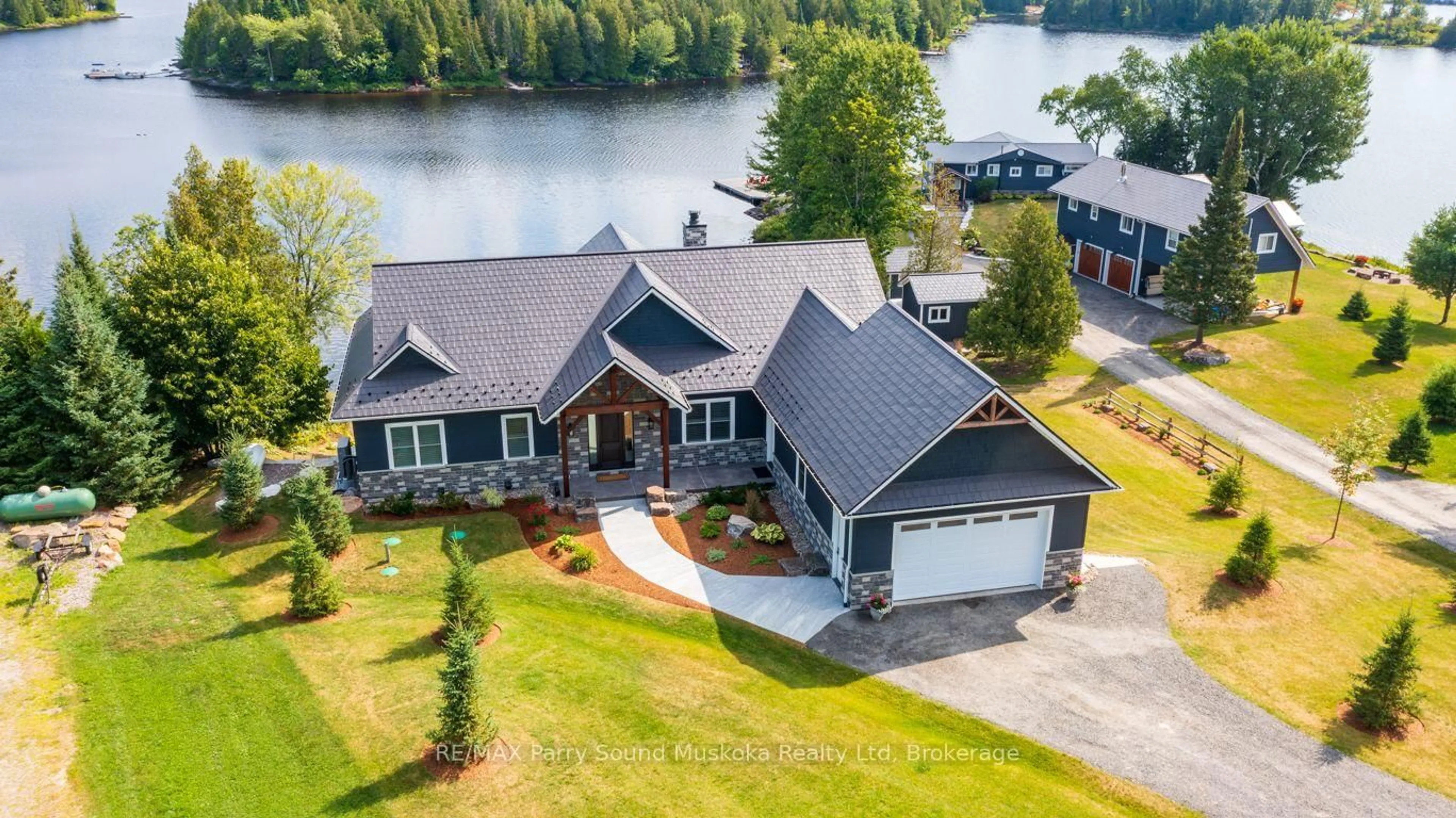 A pic from outside/outdoor area/front of a property/back of a property/a pic from drone, water/lake/river/ocean view for 19 Bears Paw, Whitestone Ontario P0A 1G0