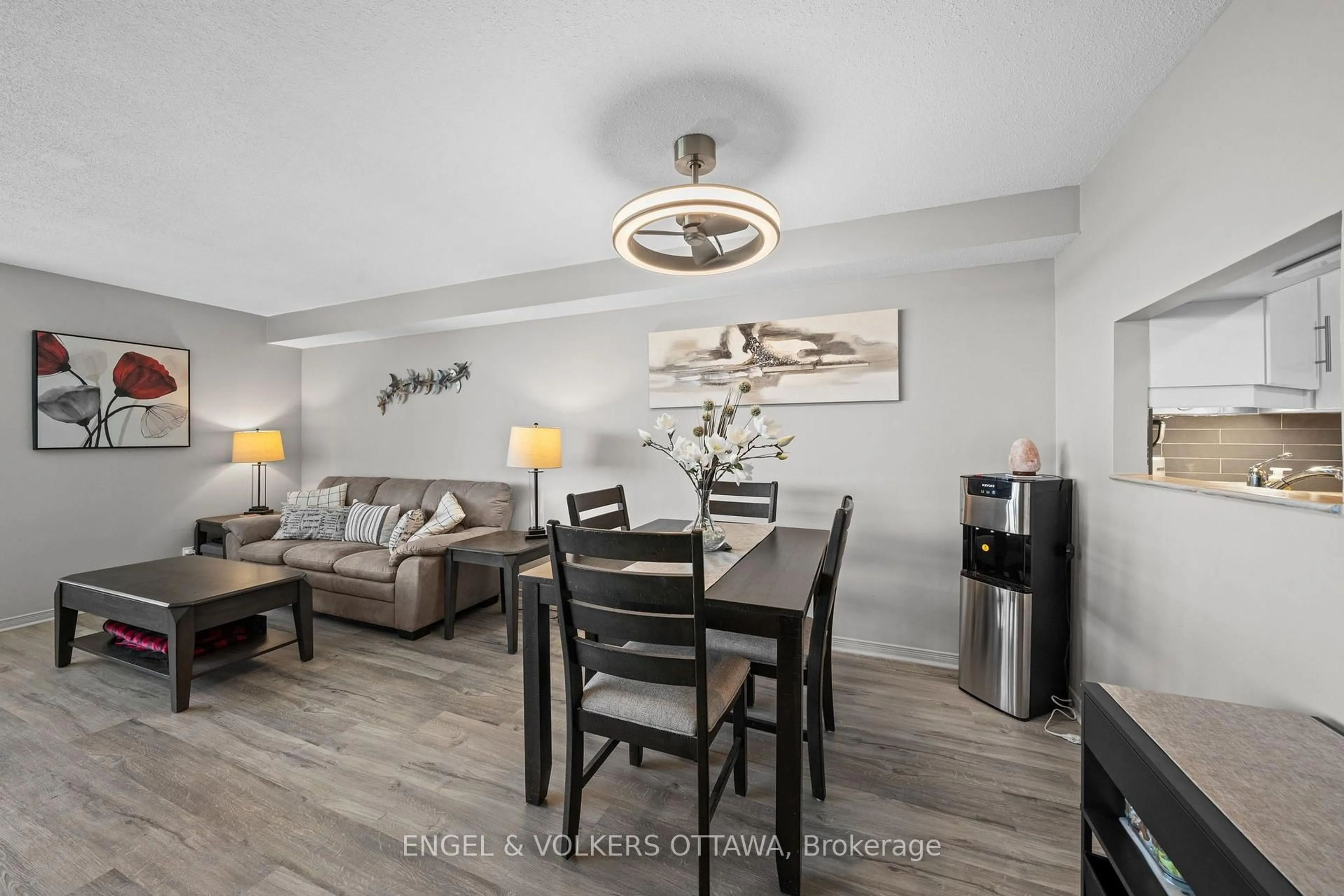 Living room with furniture, wood/laminate floor for 80 Sandcastle Dr #1213, Ottawa Ontario K2H 9E7
