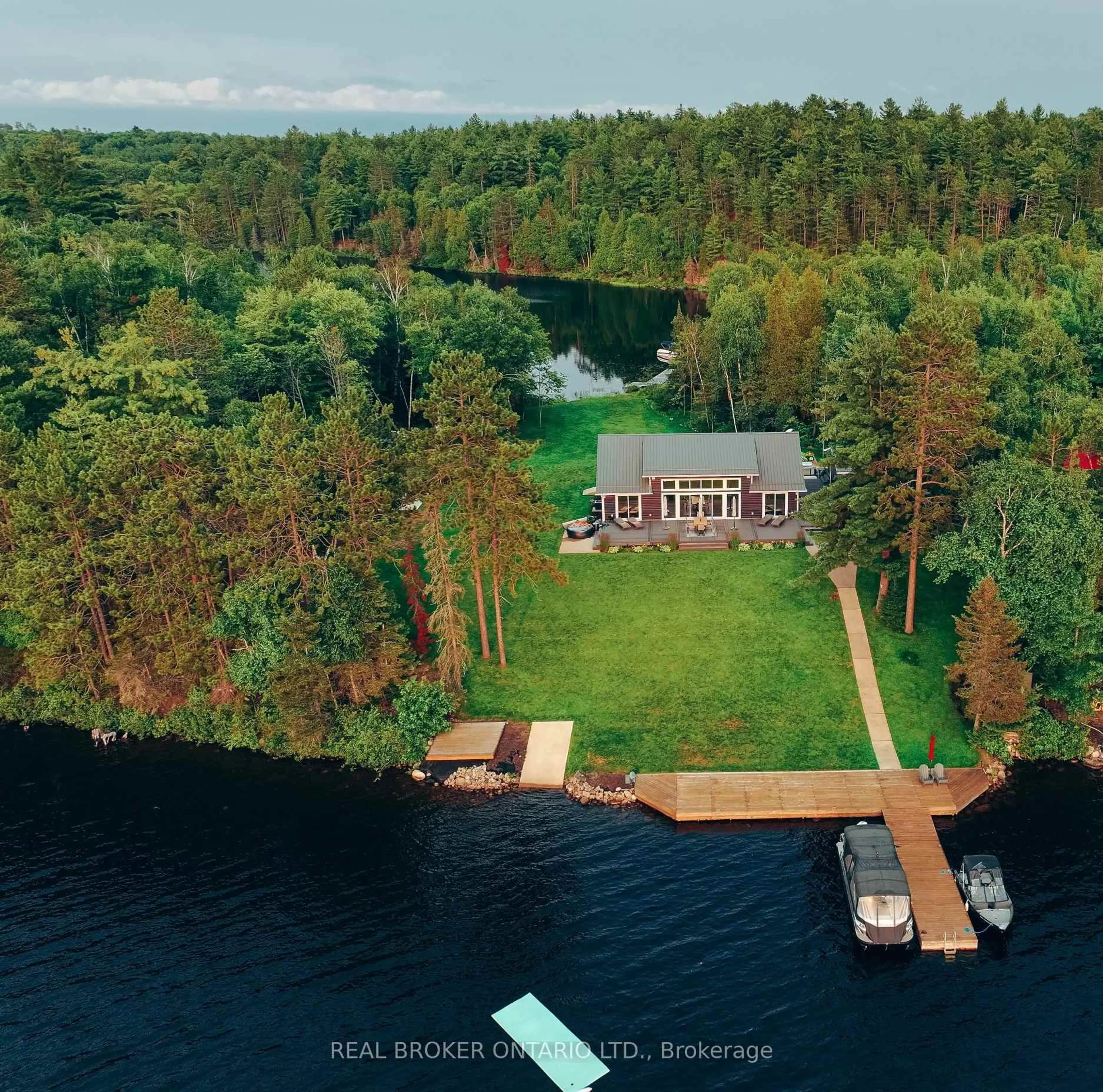 A pic from outside/outdoor area/front of a property/back of a property/a pic from drone, water/lake/river/ocean view for 7 La Casa Del Lago Rd, Greater Sudbury Ontario P3E 4N1