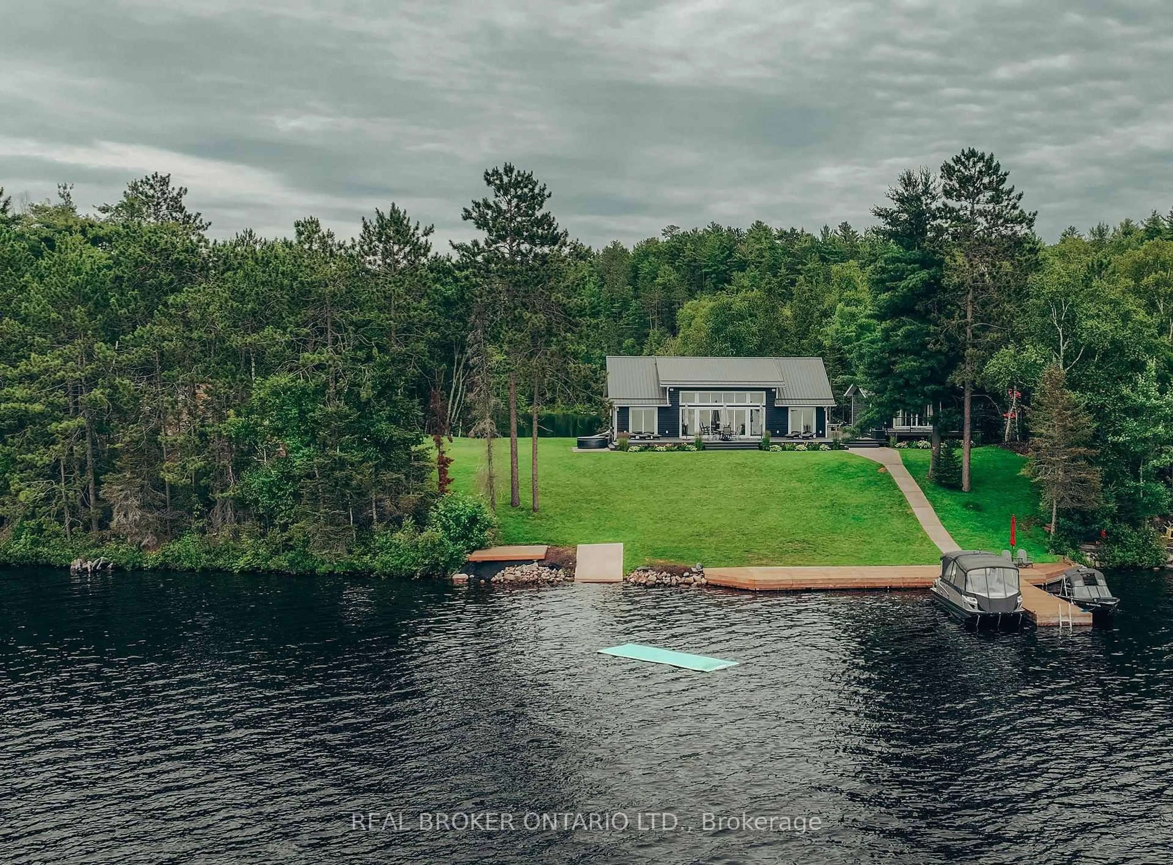 A pic from outside/outdoor area/front of a property/back of a property/a pic from drone, water/lake/river/ocean view for 7 La Casa Del Lago Rd, Greater Sudbury Ontario P3E 4N1