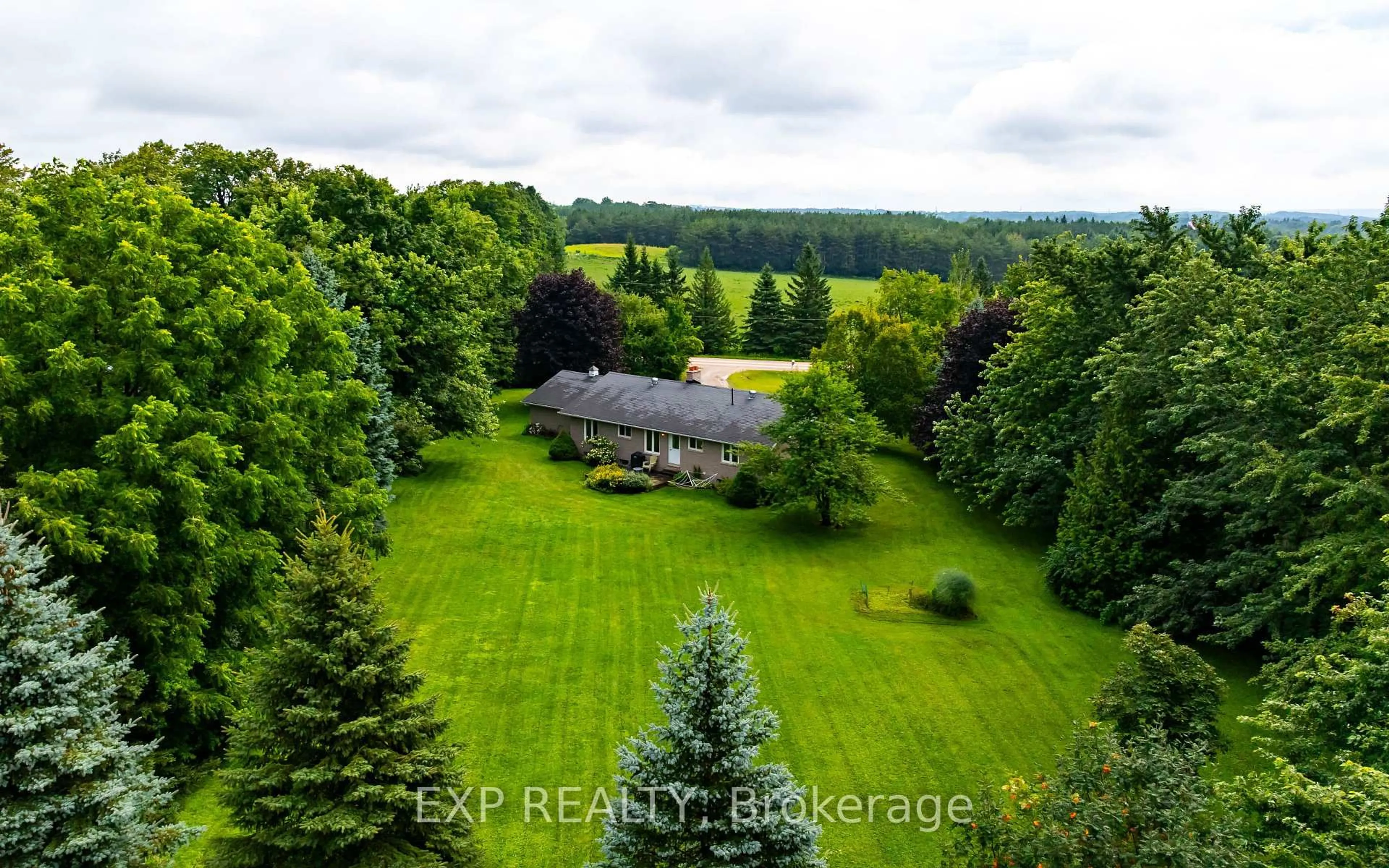 A pic from outside/outdoor area/front of a property/back of a property/a pic from drone, forest/trees view for 594356 Blind Line, Mono Ontario L9W 5N3