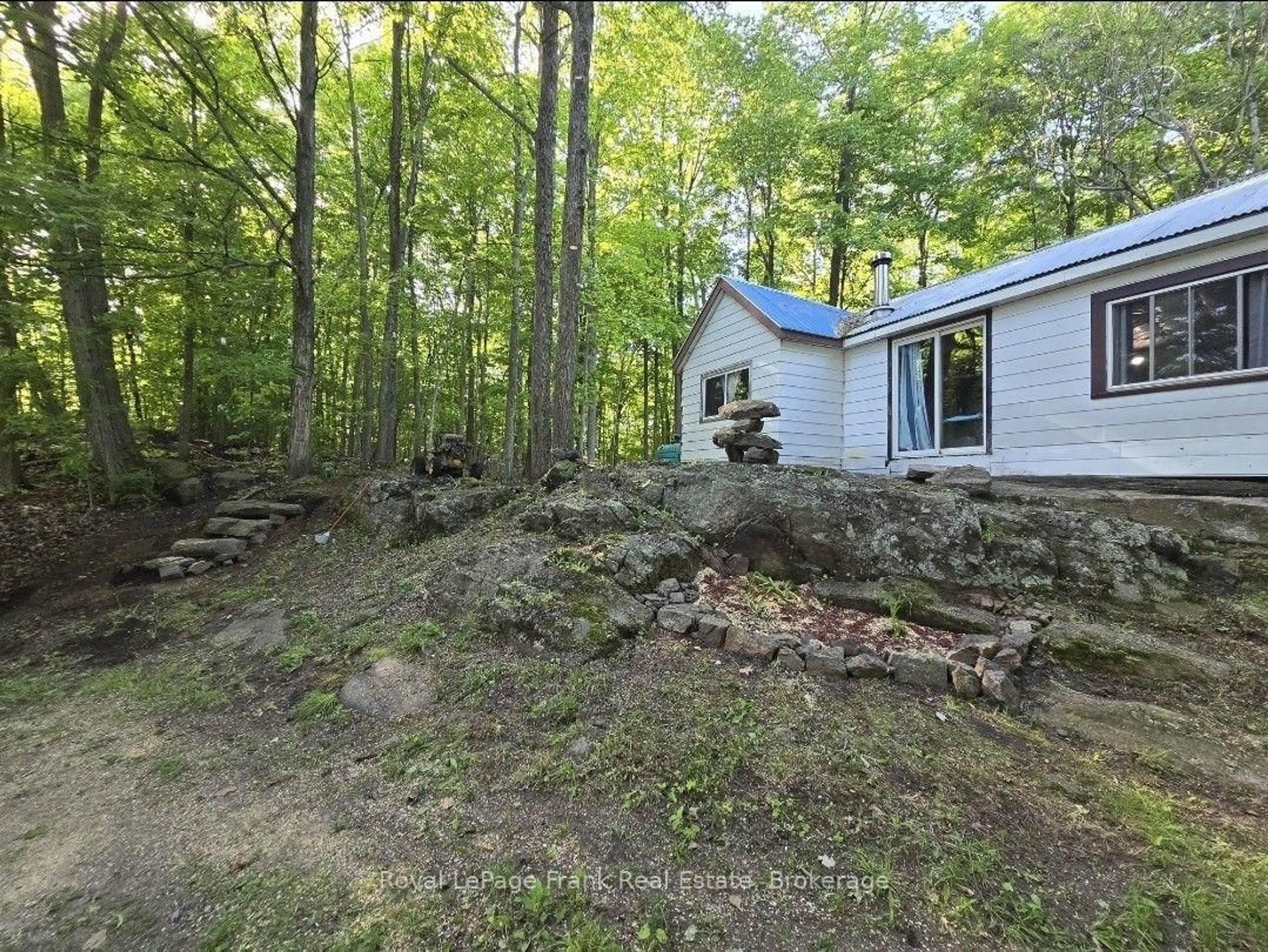 A pic from outside/outdoor area/front of a property/back of a property/a pic from drone, forest/trees view for 83 Powell Bay Rd, Rideau Lakes Ontario K0G 1E0
