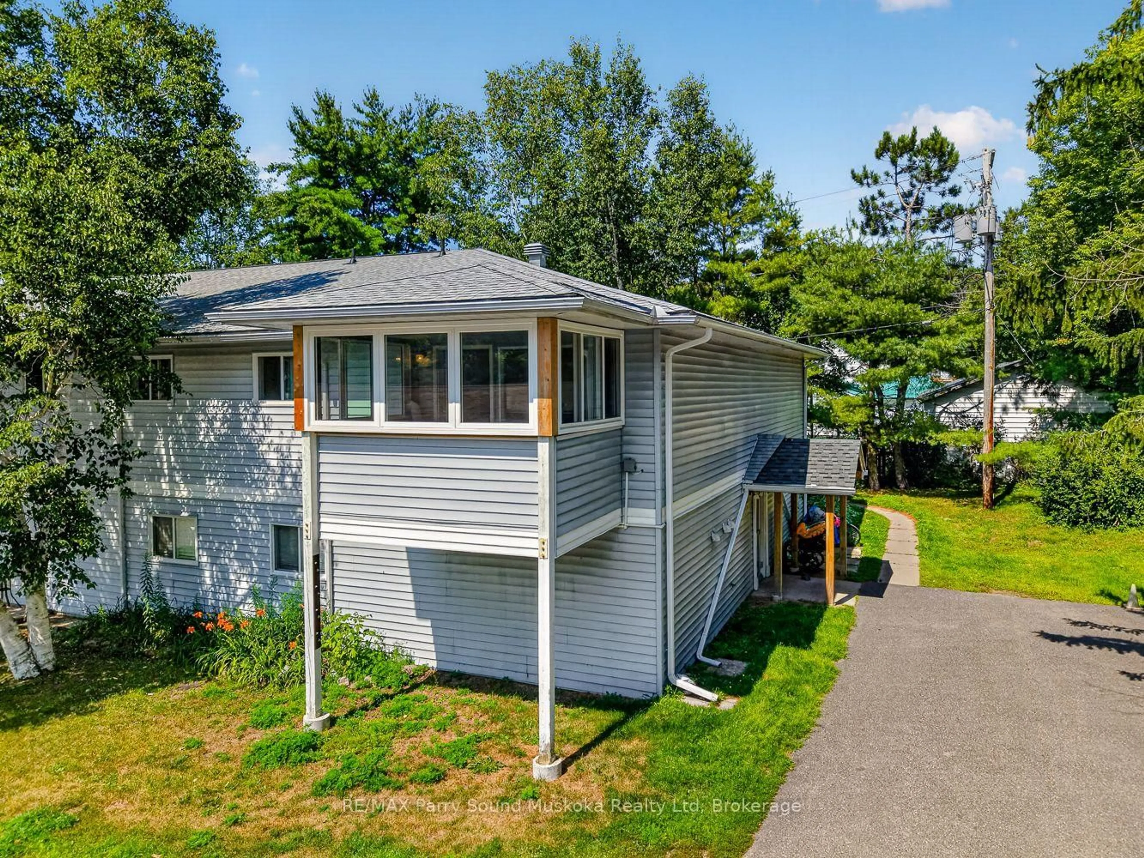 A pic from outside/outdoor area/front of a property/back of a property/a pic from drone, unknown for 1 Georgian Bay Ave #206, Parry Sound Ontario P2A 3B1
