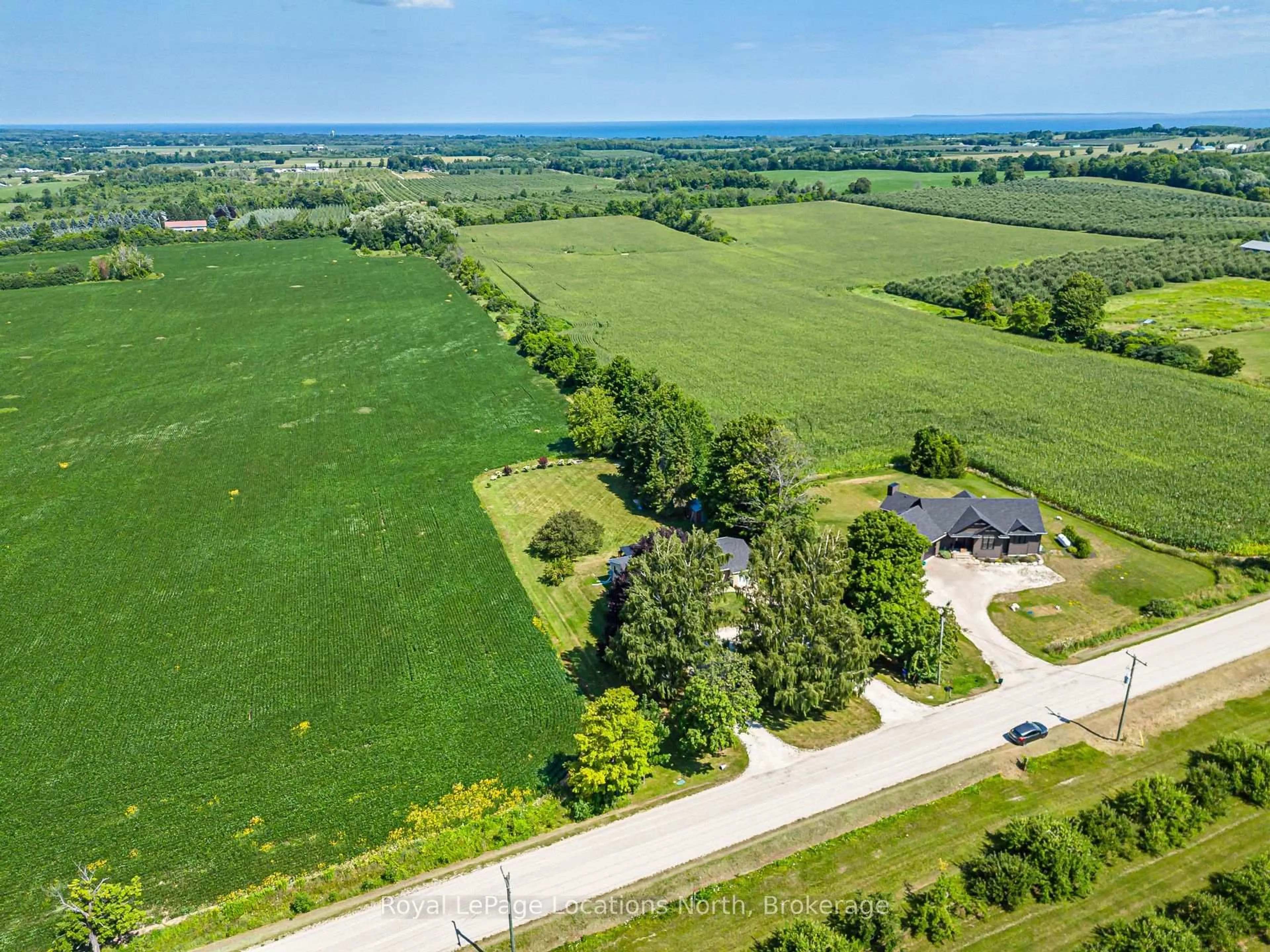 A pic from outside/outdoor area/front of a property/back of a property/a pic from drone, water/lake/river/ocean view for 728099 21 Sdrd, Blue Mountains Ontario N0H 1J0