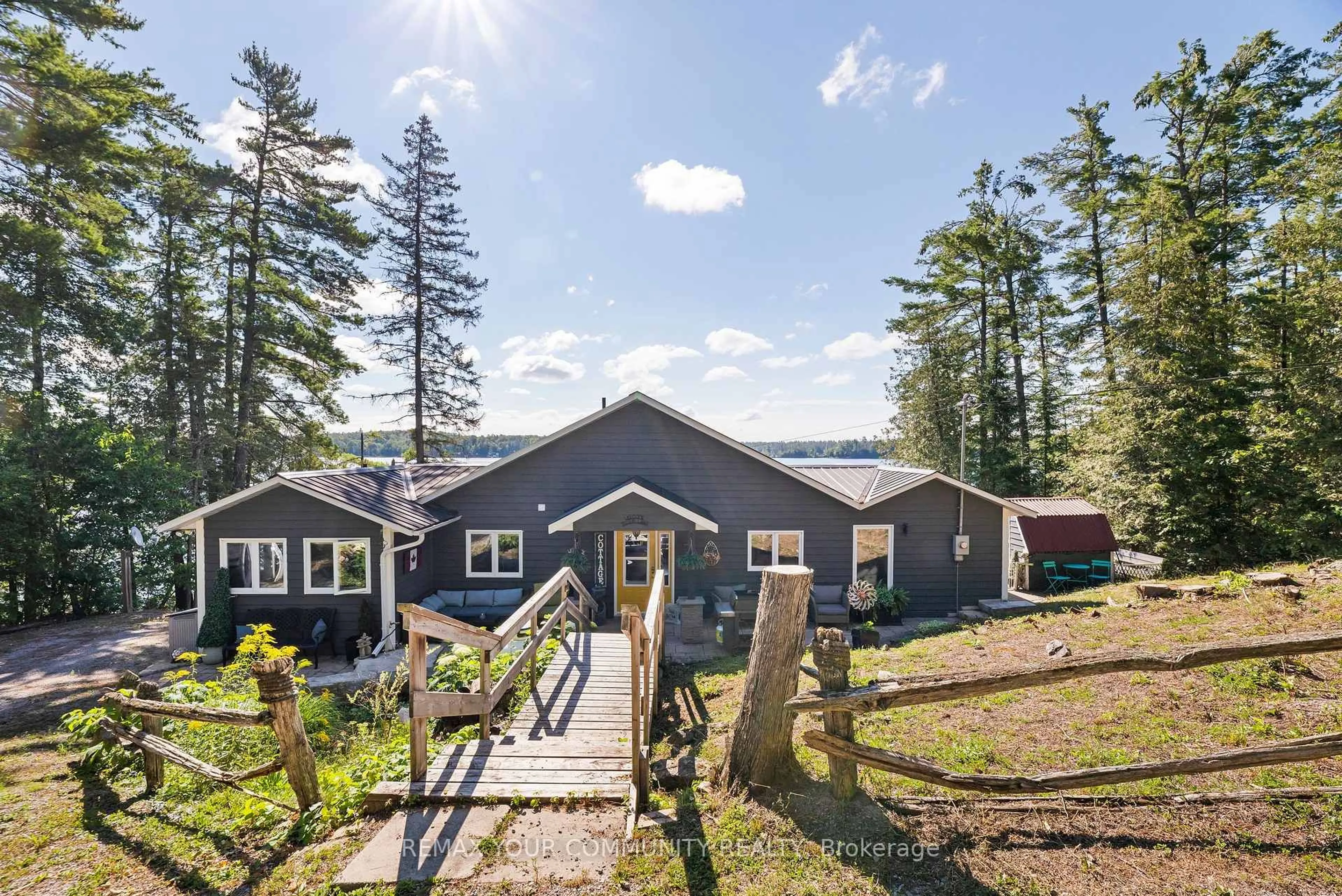 A pic from outside/outdoor area/front of a property/back of a property/a pic from drone, water/lake/river/ocean view for 511 East Clear Bay Rd, Trent Lakes Ontario K0M 2A0