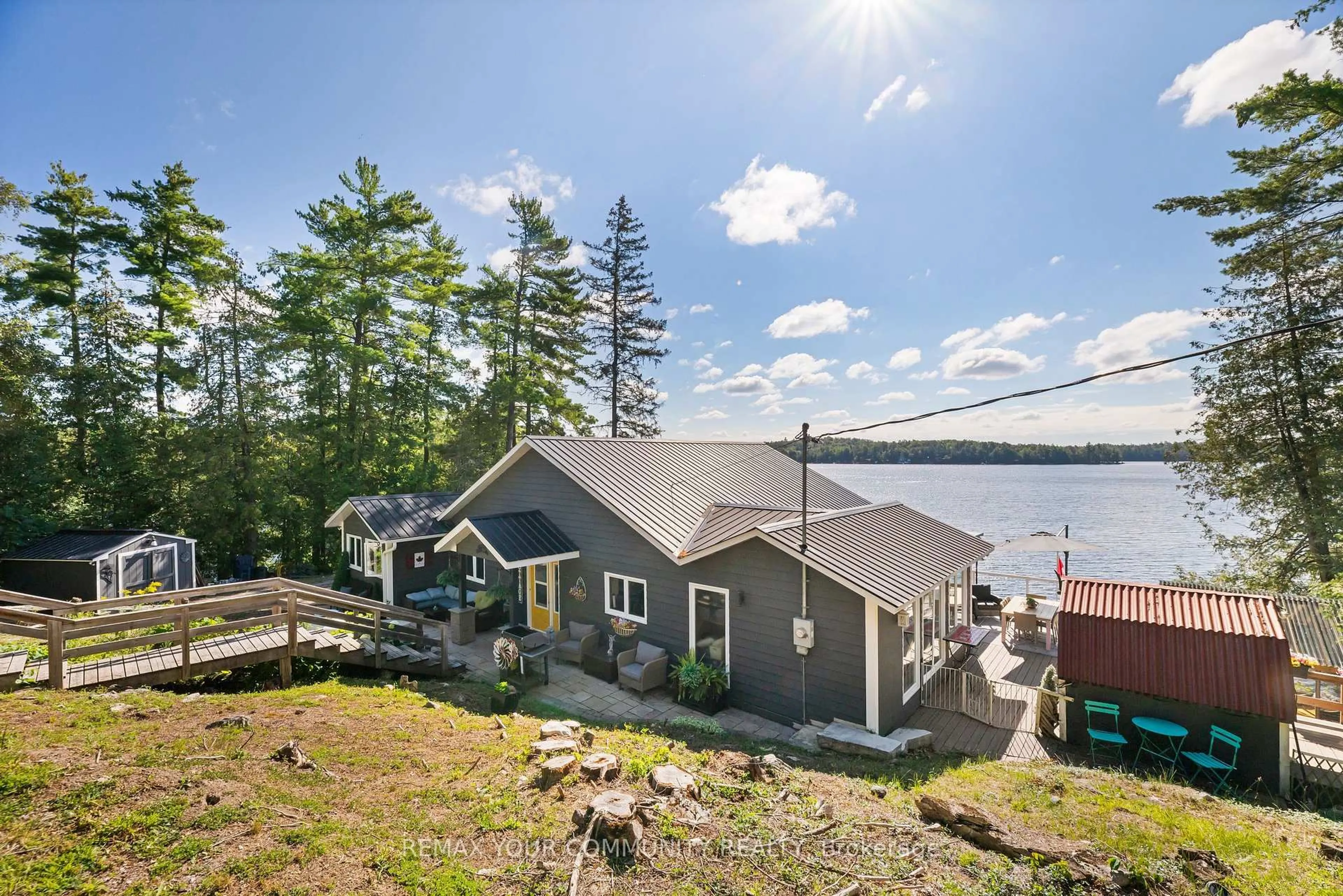 A pic from outside/outdoor area/front of a property/back of a property/a pic from drone, water/lake/river/ocean view for 511 East Clear Bay Rd, Trent Lakes Ontario K0M 2A0