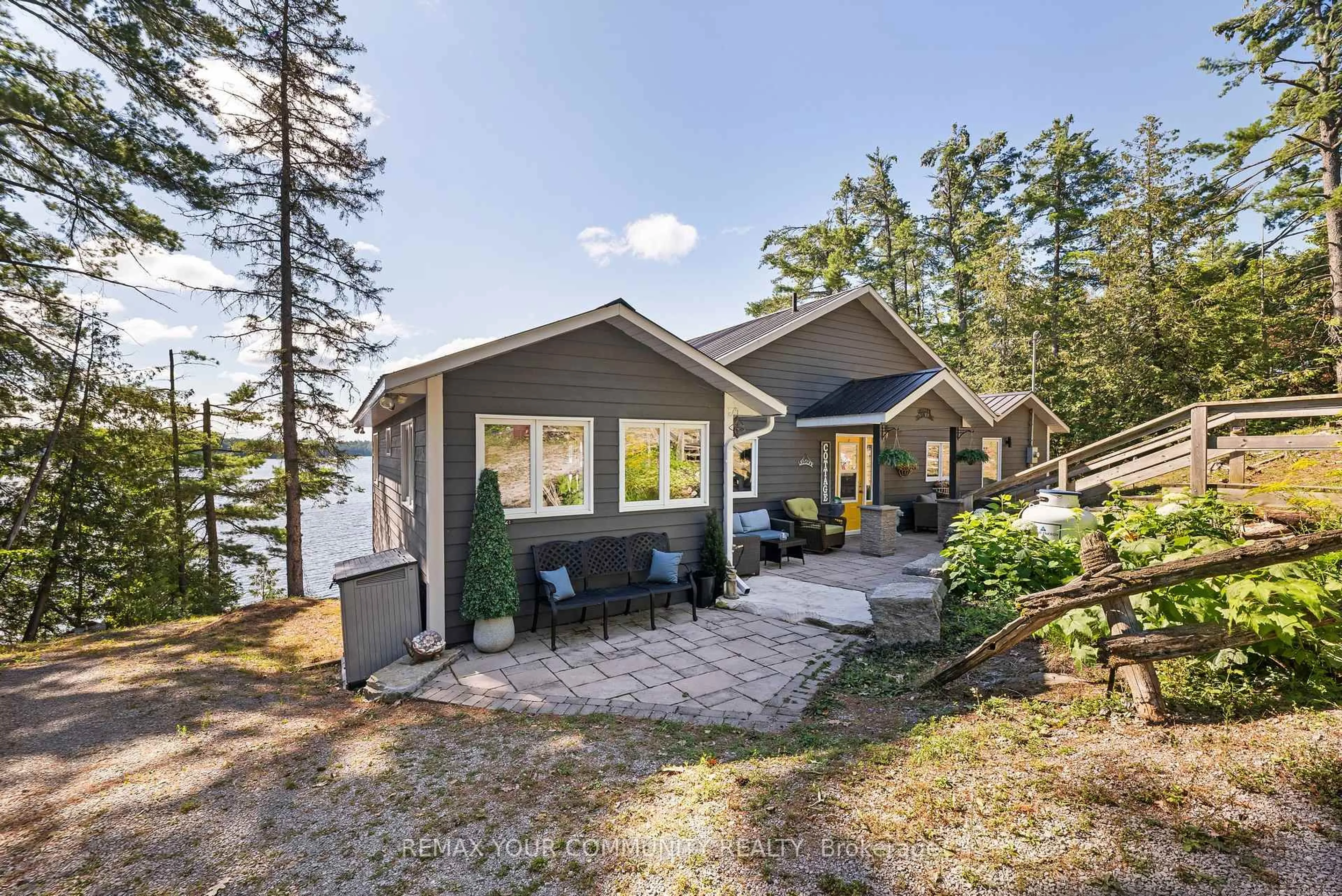 Home with vinyl exterior material, water/lake/river/ocean view for 511 East Clear Bay Rd, Trent Lakes Ontario K0M 2A0