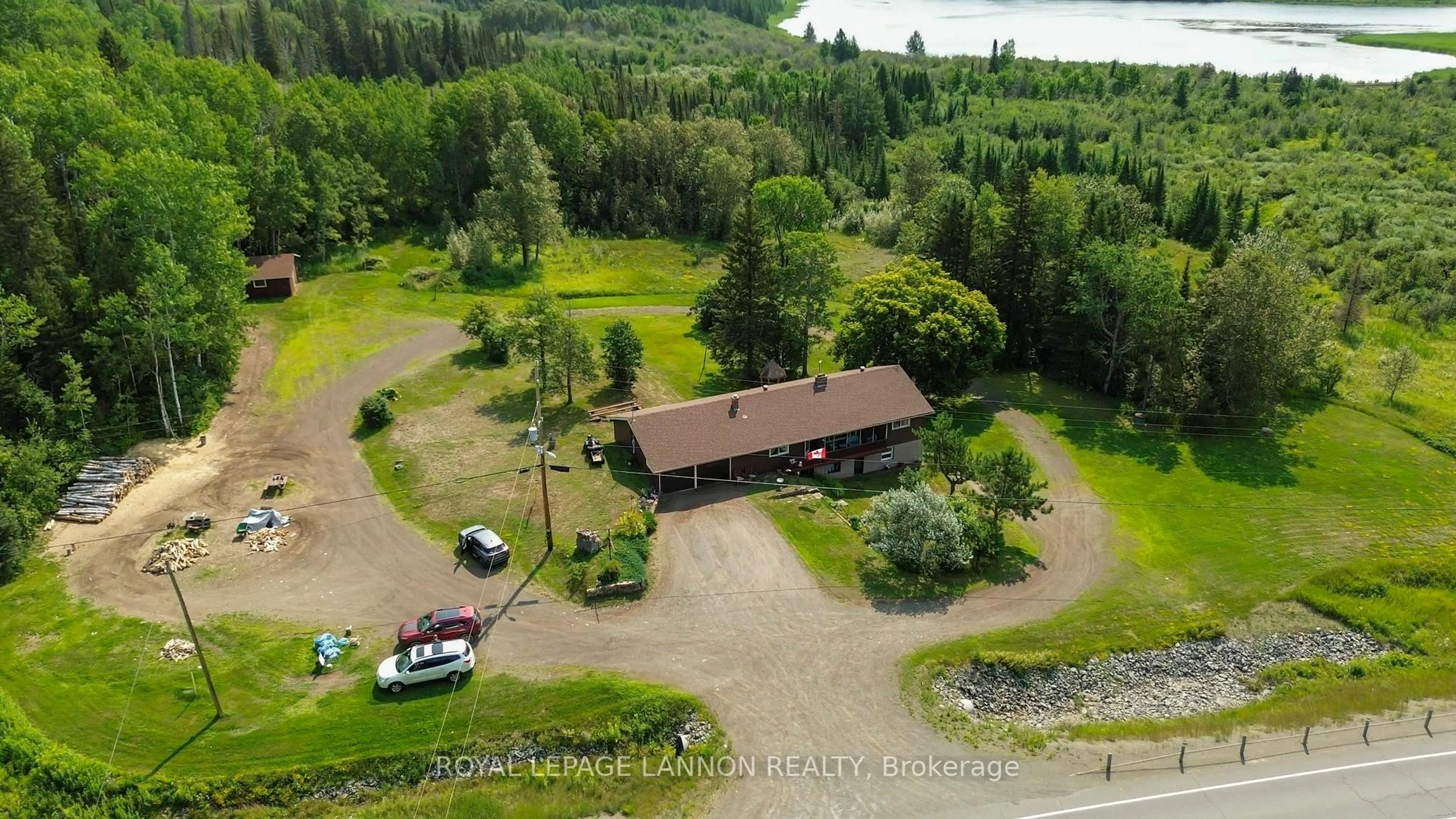 A pic from outside/outdoor area/front of a property/back of a property/a pic from drone, water/lake/river/ocean view for 5140 Hwy 11/17, Conmee Ontario P7K 0H7