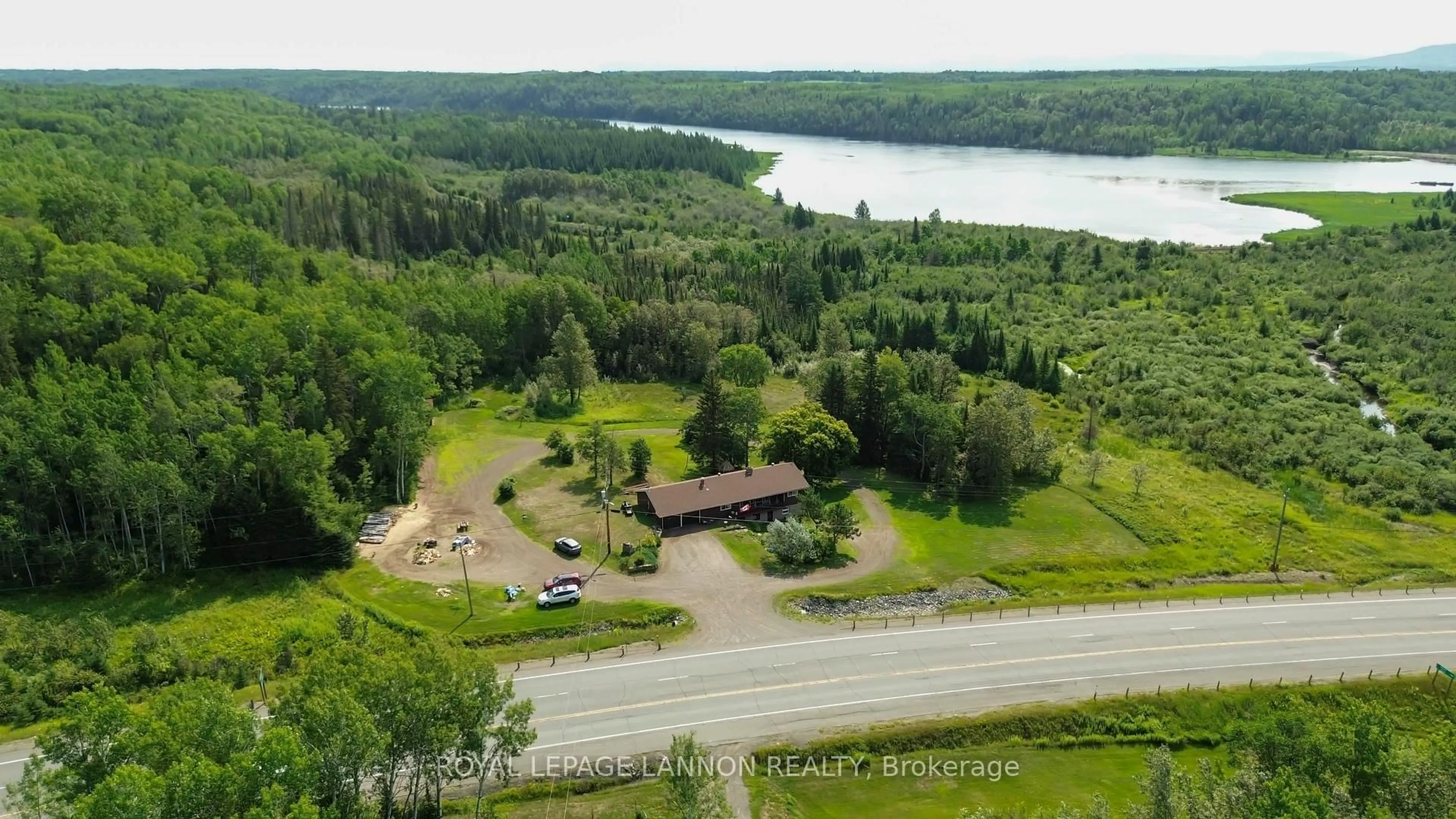 A pic from outside/outdoor area/front of a property/back of a property/a pic from drone, water/lake/river/ocean view for 5140 Hwy 11/17, Conmee Ontario P7K 0H7
