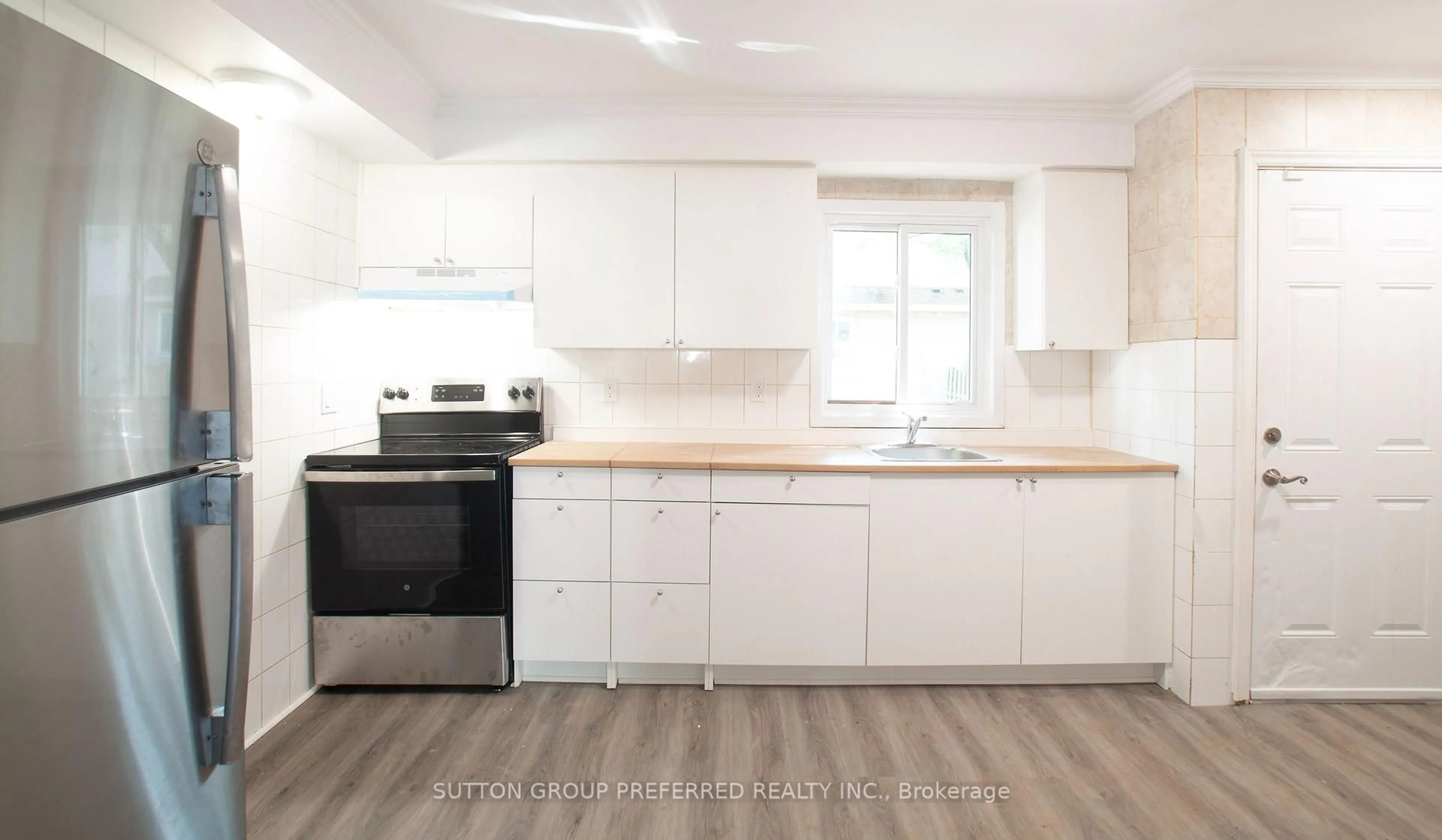 Open concept kitchen, wood/laminate floor for 311 Vesta Rd #16, London East Ontario N5Y 5H9