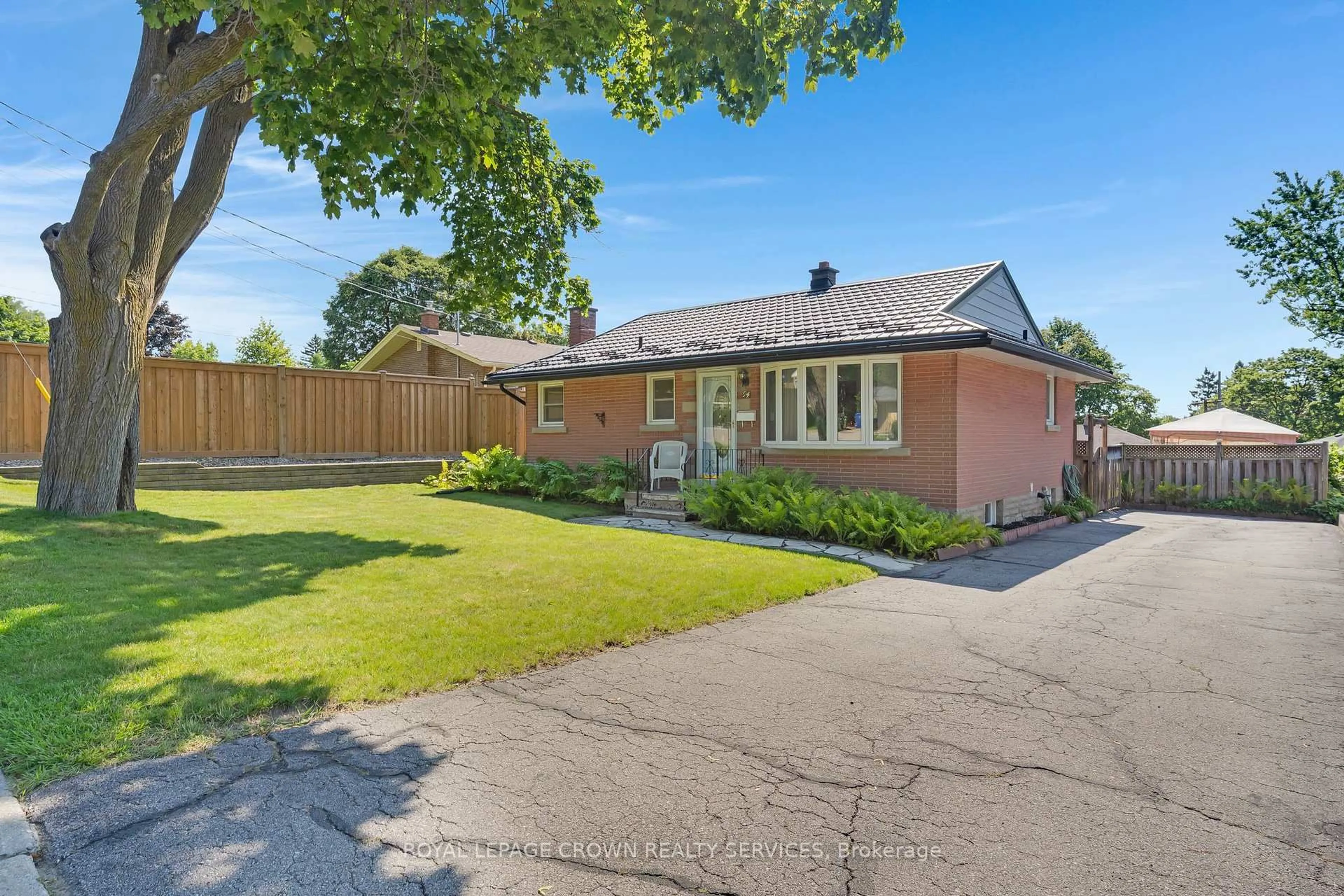 Home with brick exterior material, street for 94 Ottawa Cres, Guelph Ontario N1E 2A9