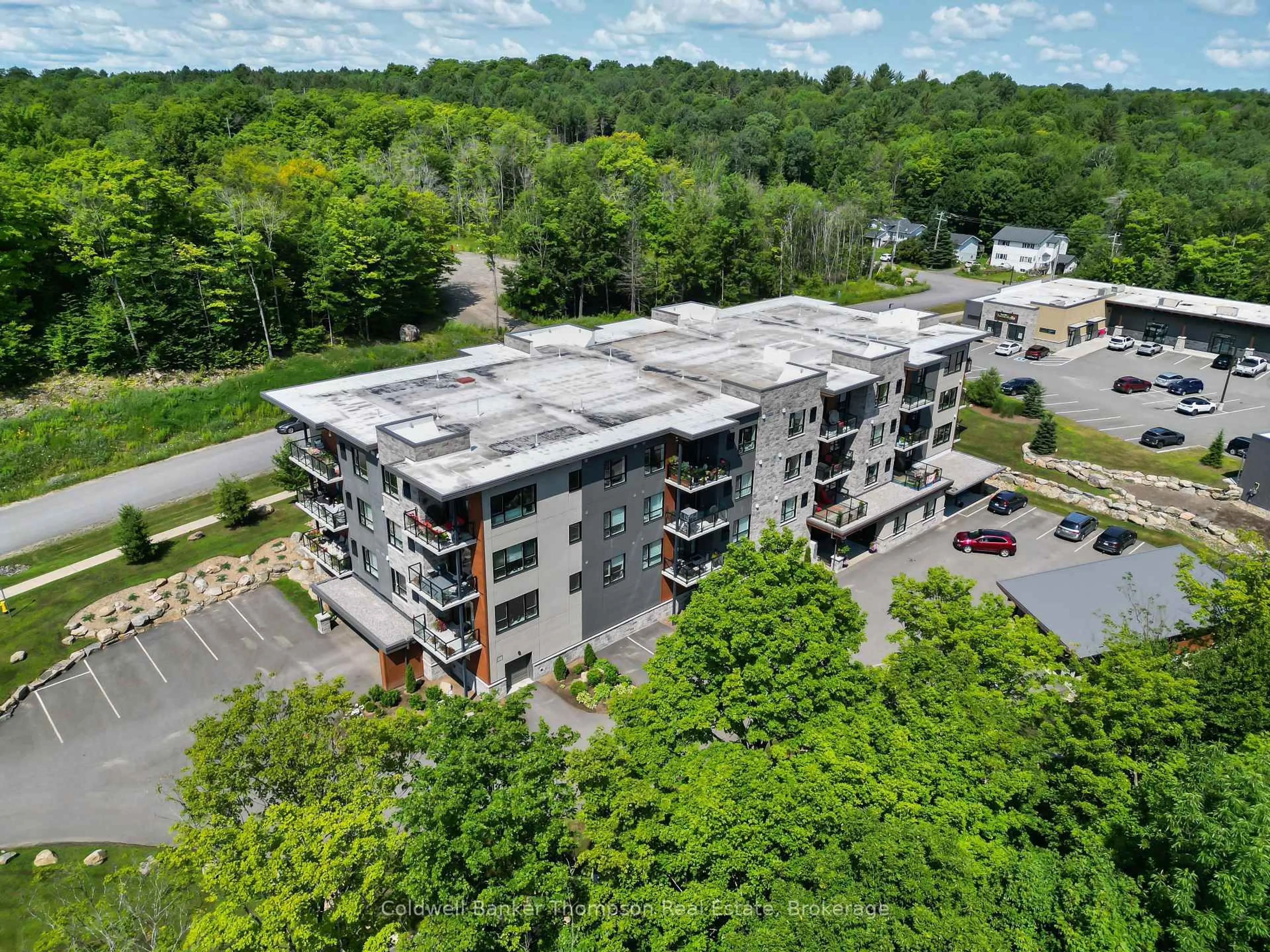 A pic from outside/outdoor area/front of a property/back of a property/a pic from drone, building for 23 Campus Tr #202, Huntsville Ontario P1H 0G1