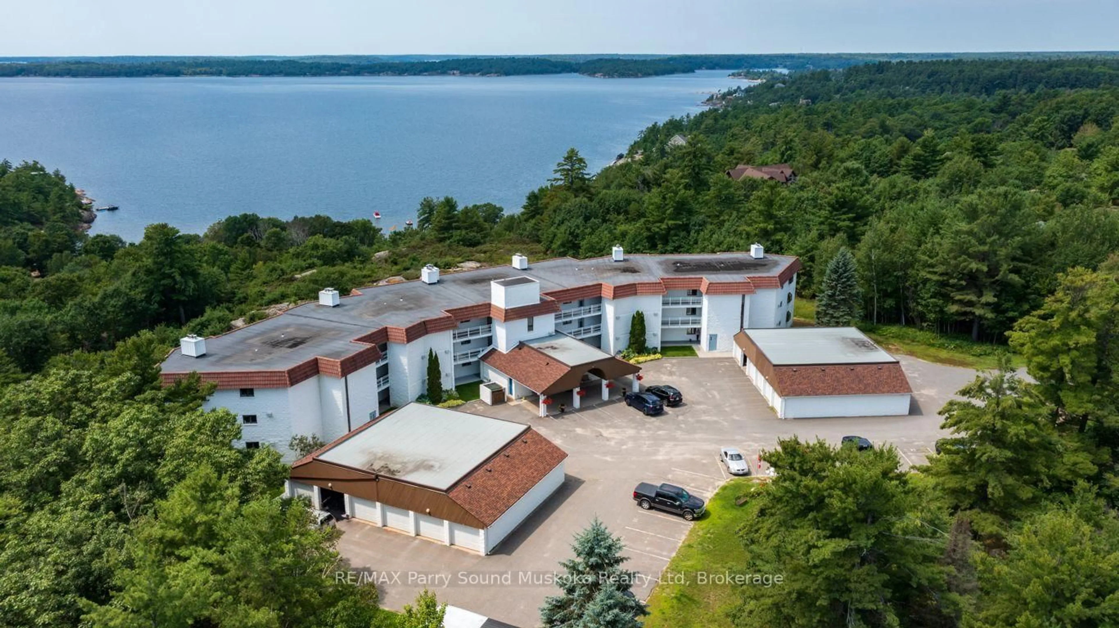 A pic from outside/outdoor area/front of a property/back of a property/a pic from drone, water/lake/river/ocean view for 20 Ryder Dr #3B, McDougall Ontario P2A 2W9