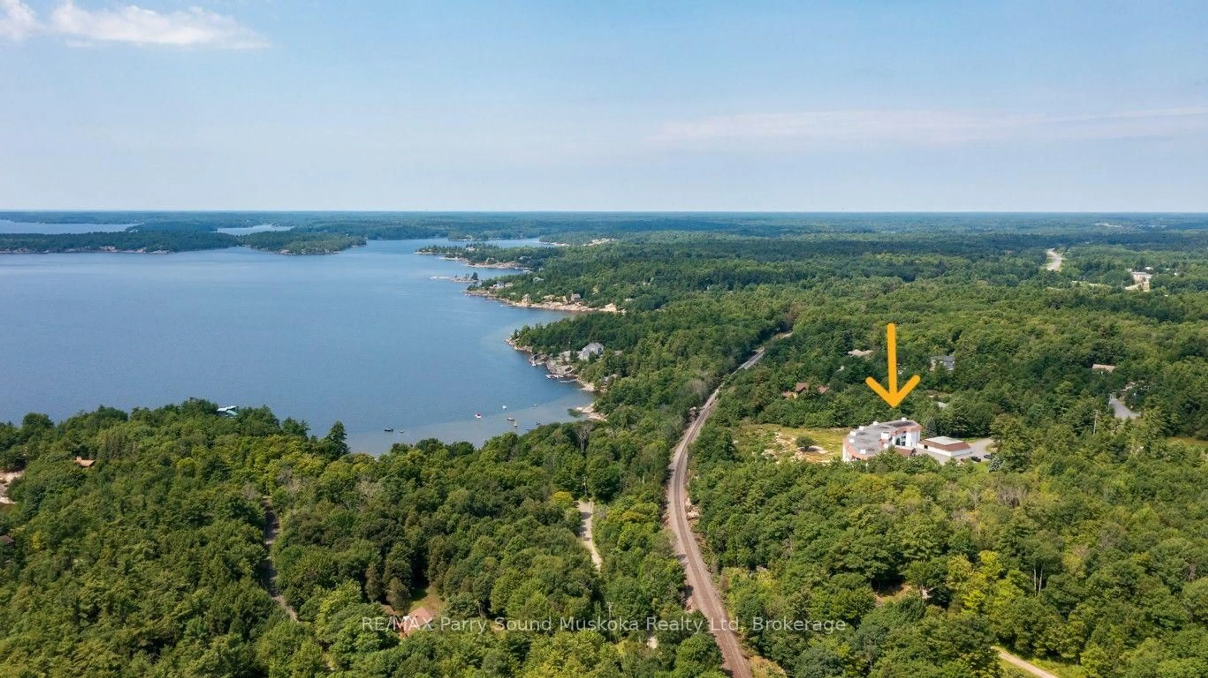 A pic from outside/outdoor area/front of a property/back of a property/a pic from drone, water/lake/river/ocean view for 20 Ryder Dr #3B, McDougall Ontario P2A 2W9