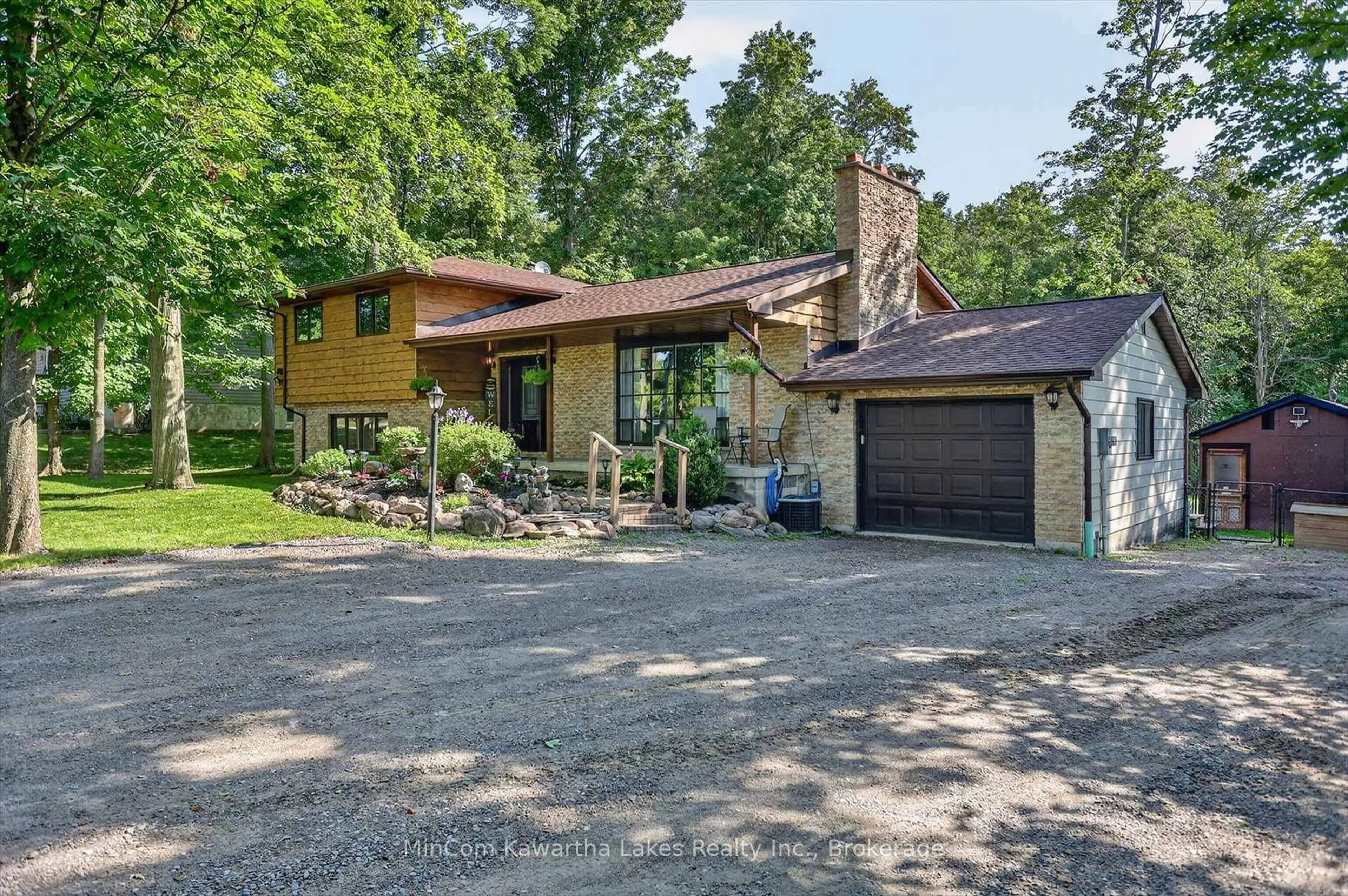 Home with brick exterior material, street for 74 Orange Corners Rd, Kawartha Lakes Ontario K0L 2W0