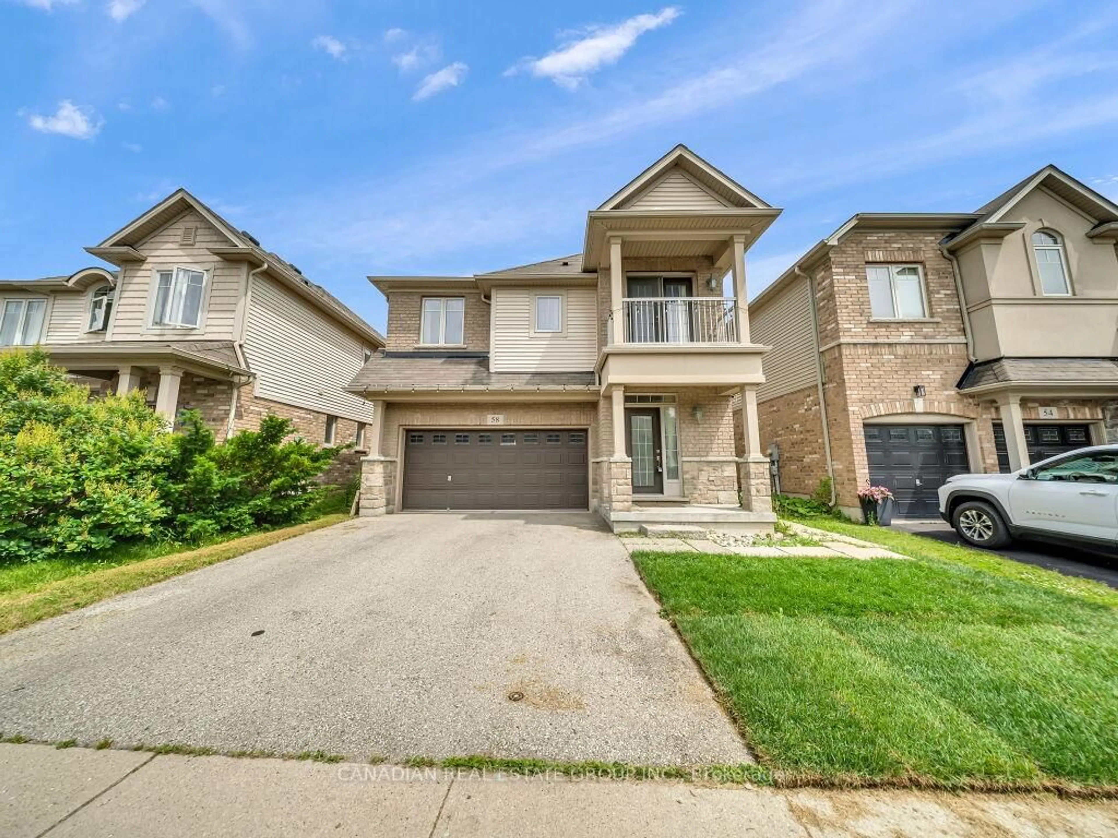 Home with brick exterior material, street for 58 Forest Creek Dr, Kitchener Ontario N2R 0B4