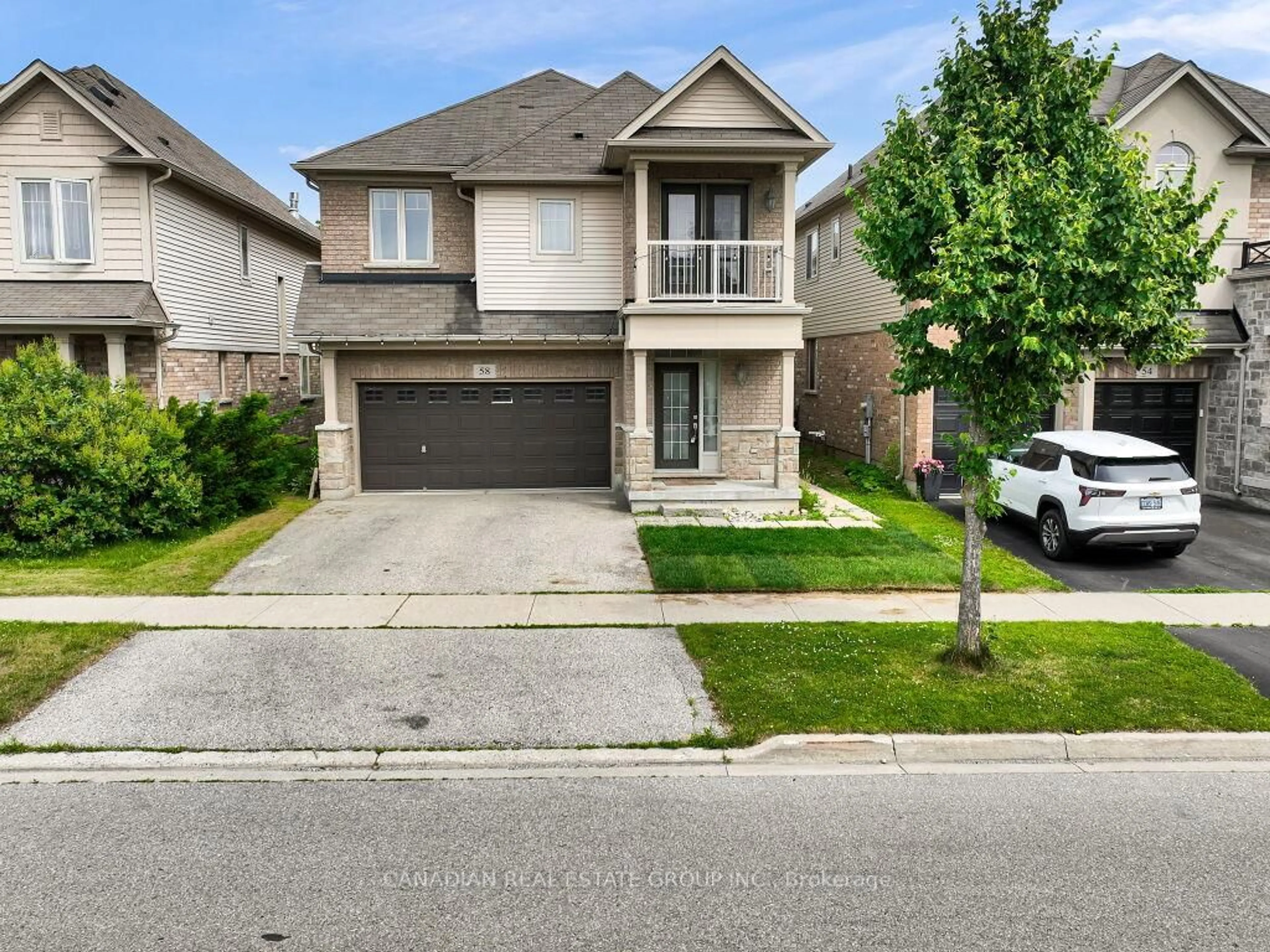 Home with brick exterior material, street for 58 Forest Creek Dr, Kitchener Ontario N2R 0B4