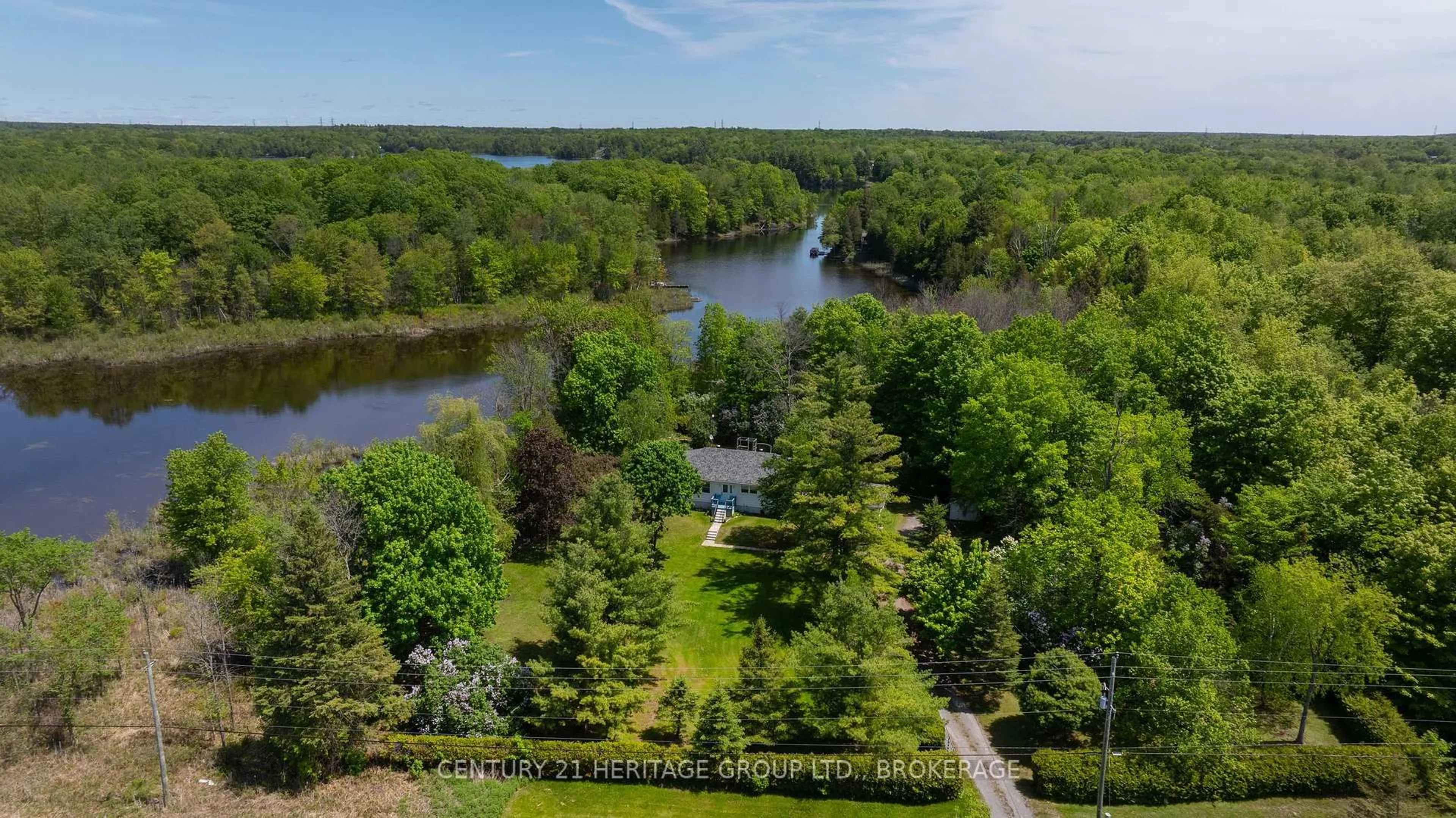 A pic from outside/outdoor area/front of a property/back of a property/a pic from drone, water/lake/river/ocean view for 6104 Highway 38, Verona Ontario K0H 2W0