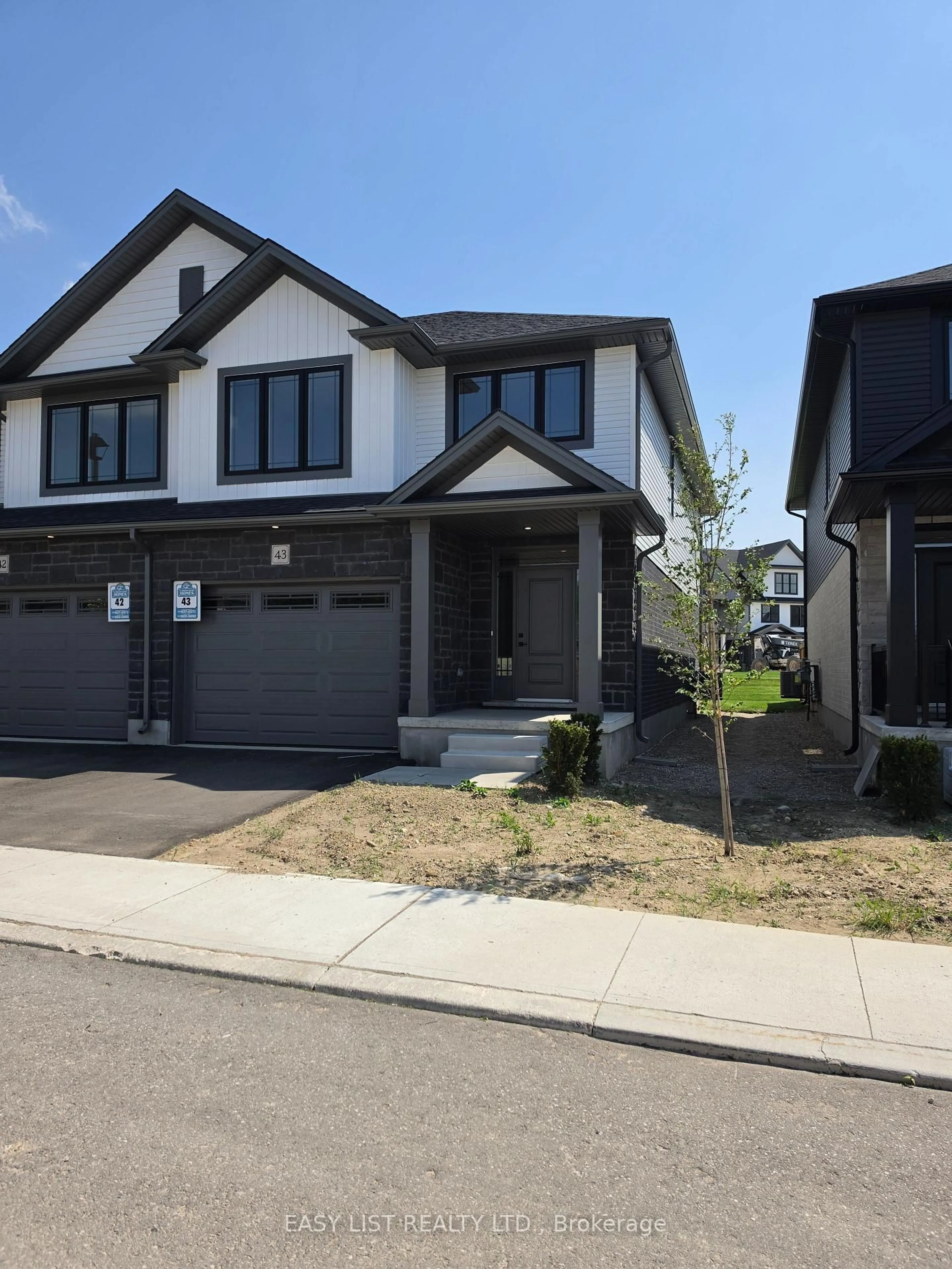 Home with brick exterior material, street for 55 Teal Dr #43, Guelph Ontario N1C 1G4