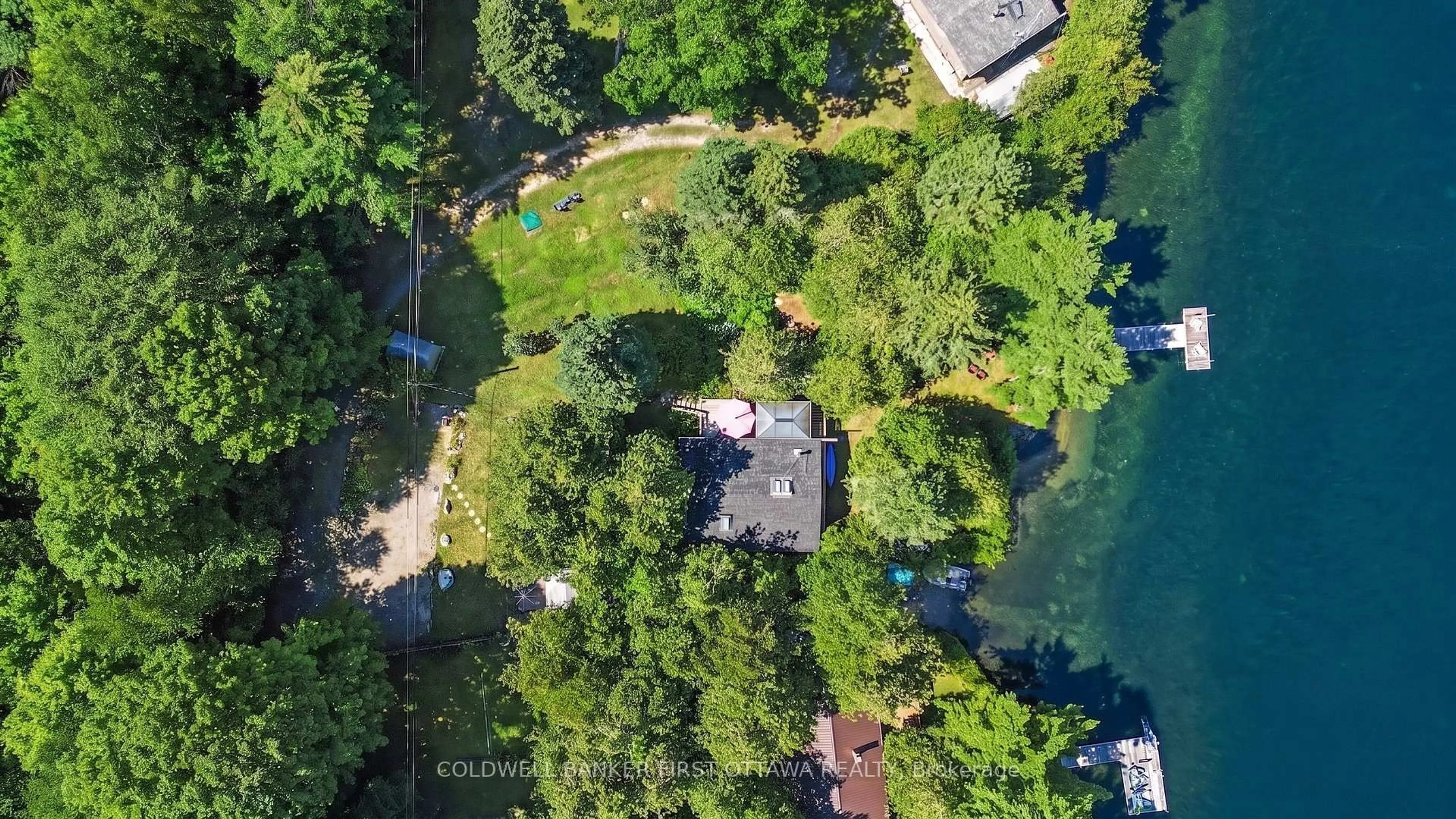 A pic from outside/outdoor area/front of a property/back of a property/a pic from drone, water/lake/river/ocean view for 440 Featherston Lane, Westport Ontario K0G 1X0