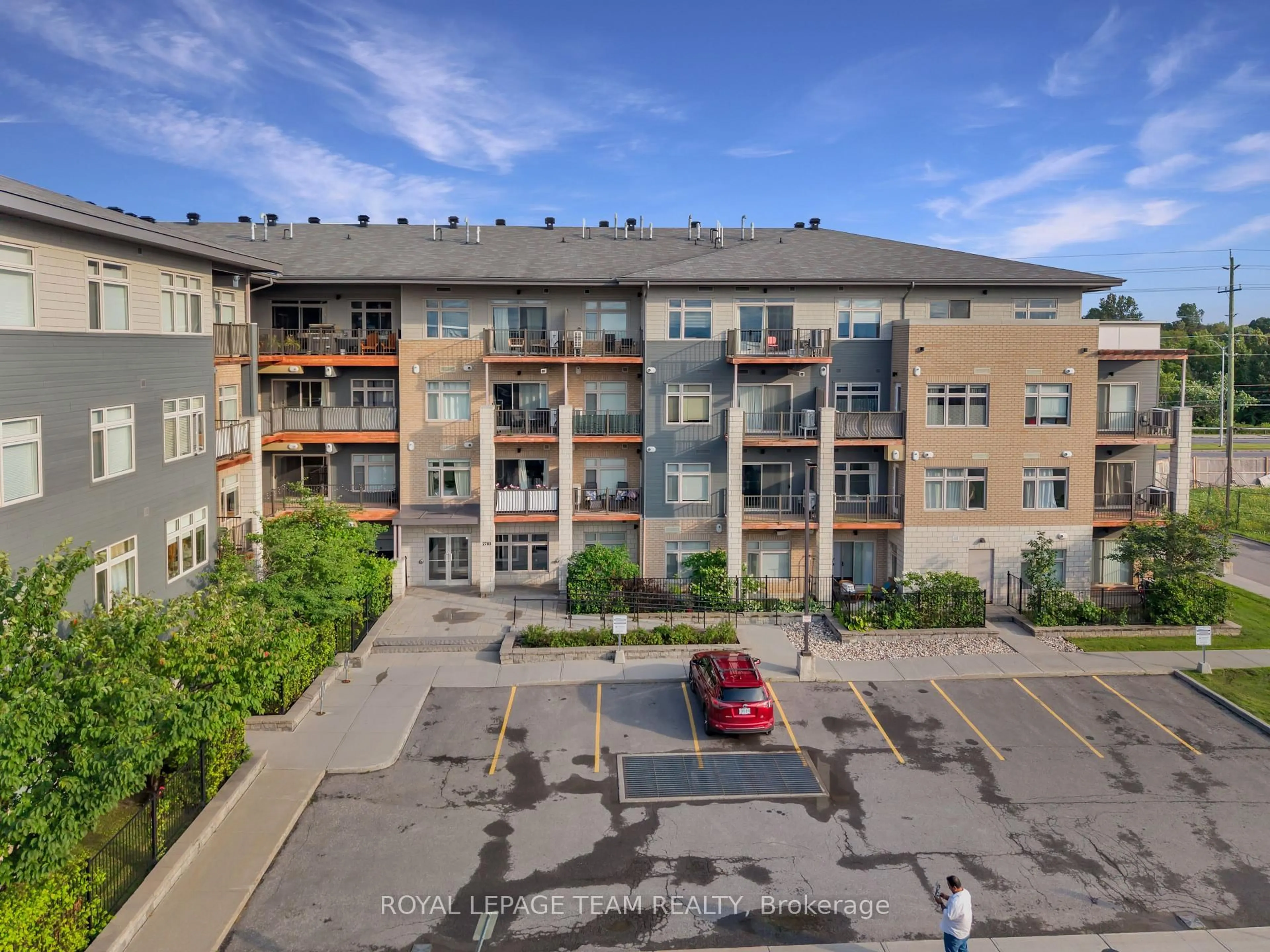 A pic from outside/outdoor area/front of a property/back of a property/a pic from drone, unknown for 2785 Baseline Rd #215, Ottawa Ontario K2H 0B7