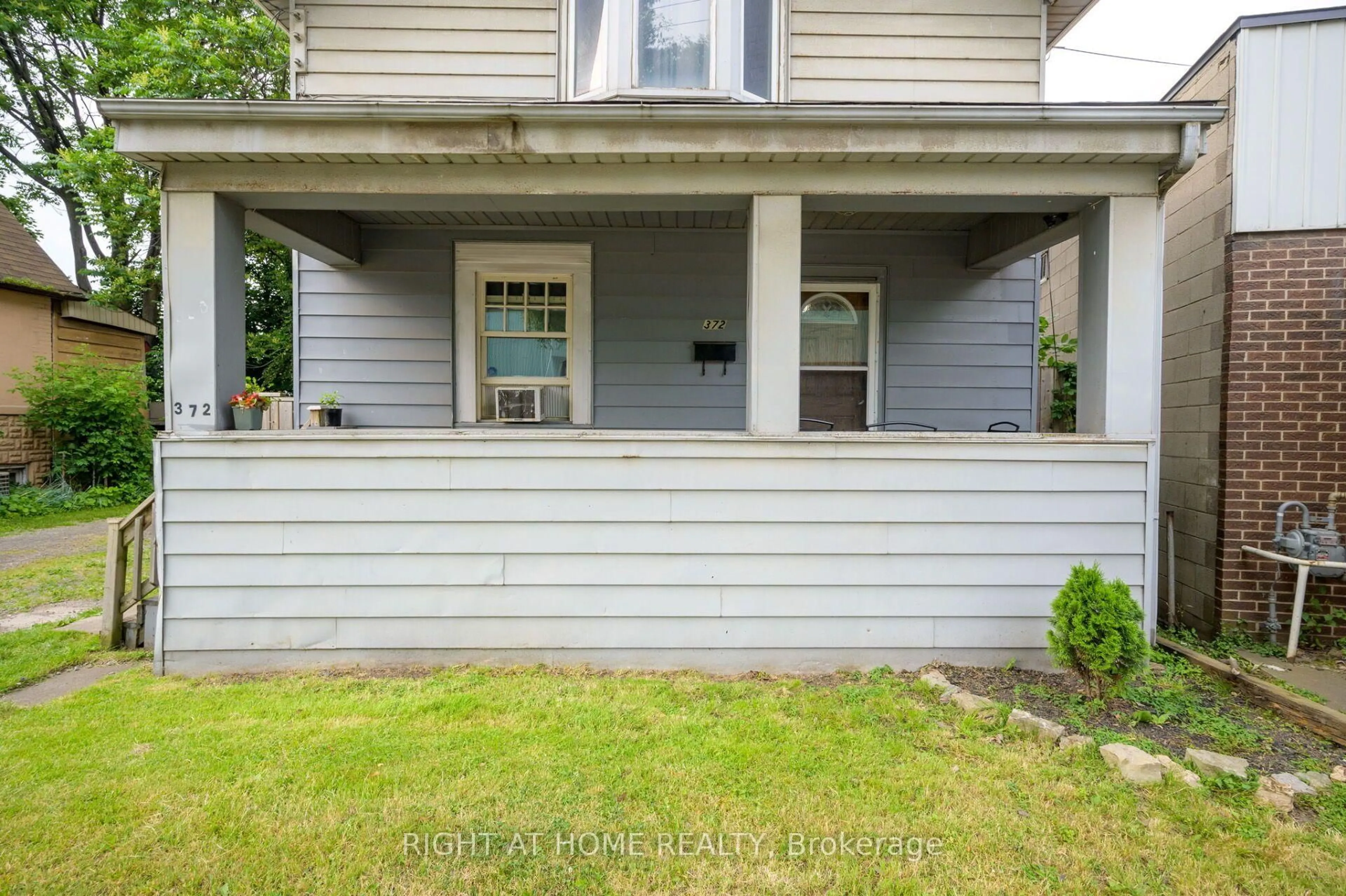 Home with vinyl exterior material, street for 372 Beach Rd, Hamilton Ontario L8H 3K5