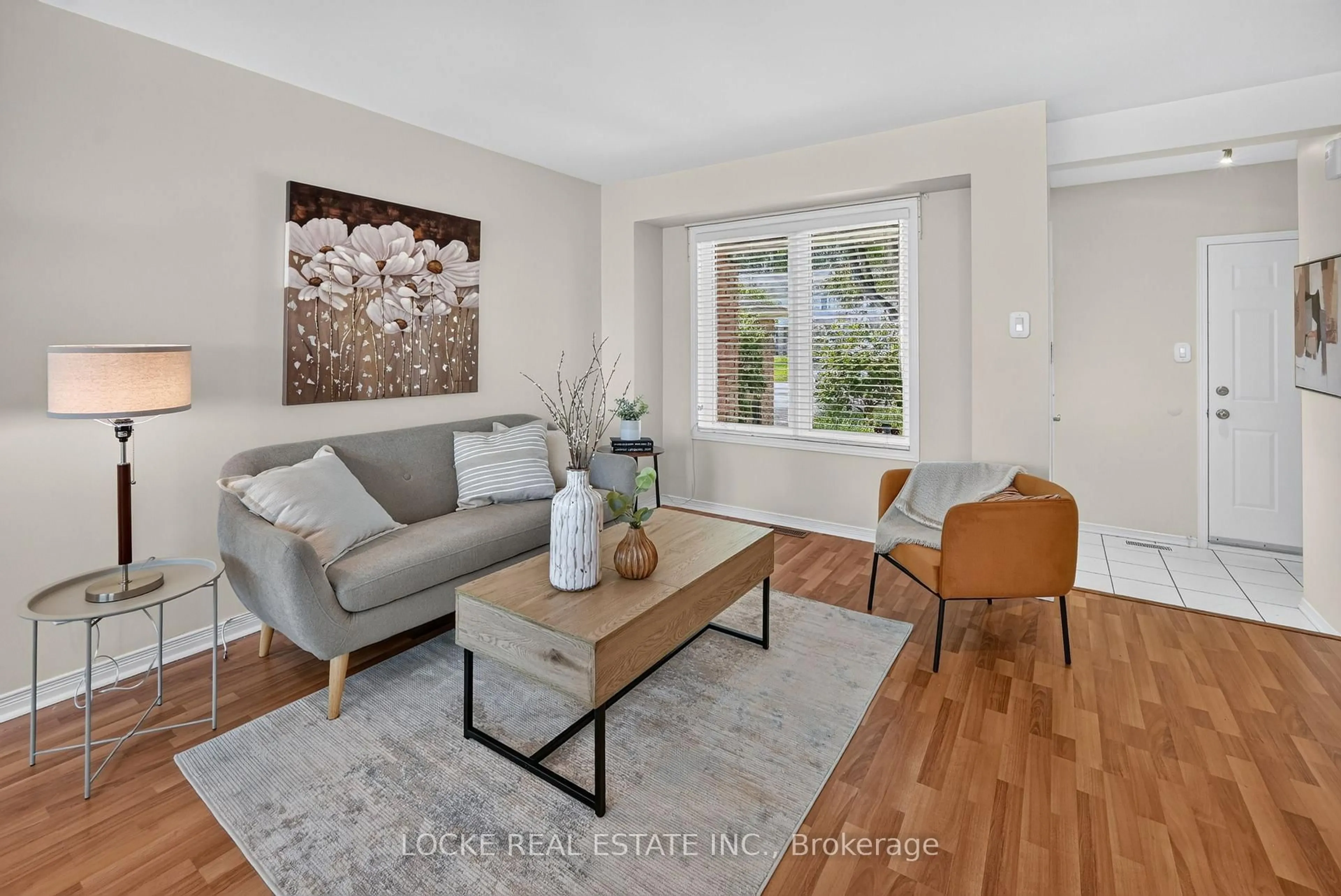 Living room with furniture, wood/laminate floor for 431 Lawler Cres, Ottawa Ontario K4A 3Y3