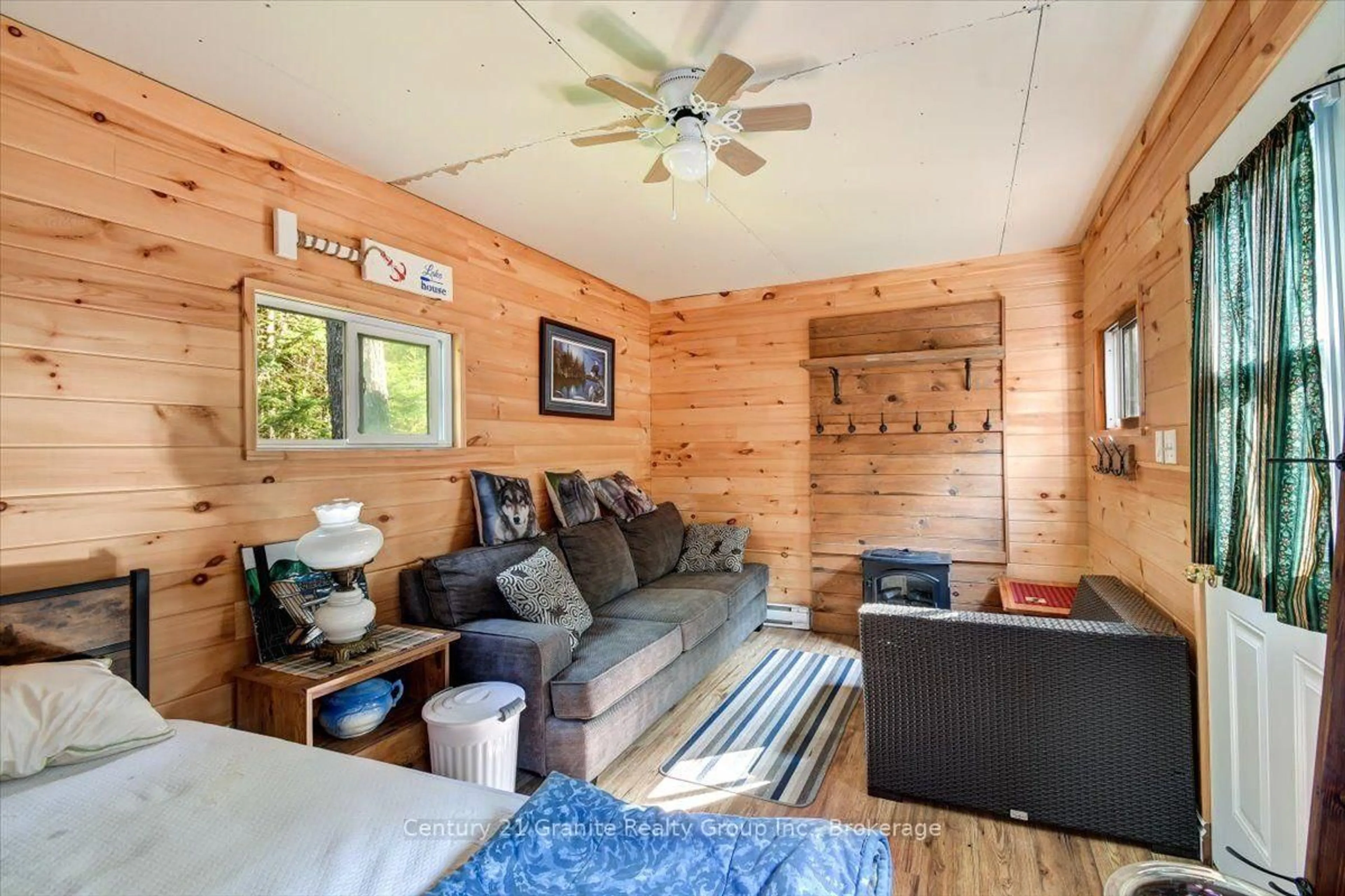 Living room with furniture, wood/laminate floor for 1144 Trinity Rd, Highlands East Ontario K0L 2A0
