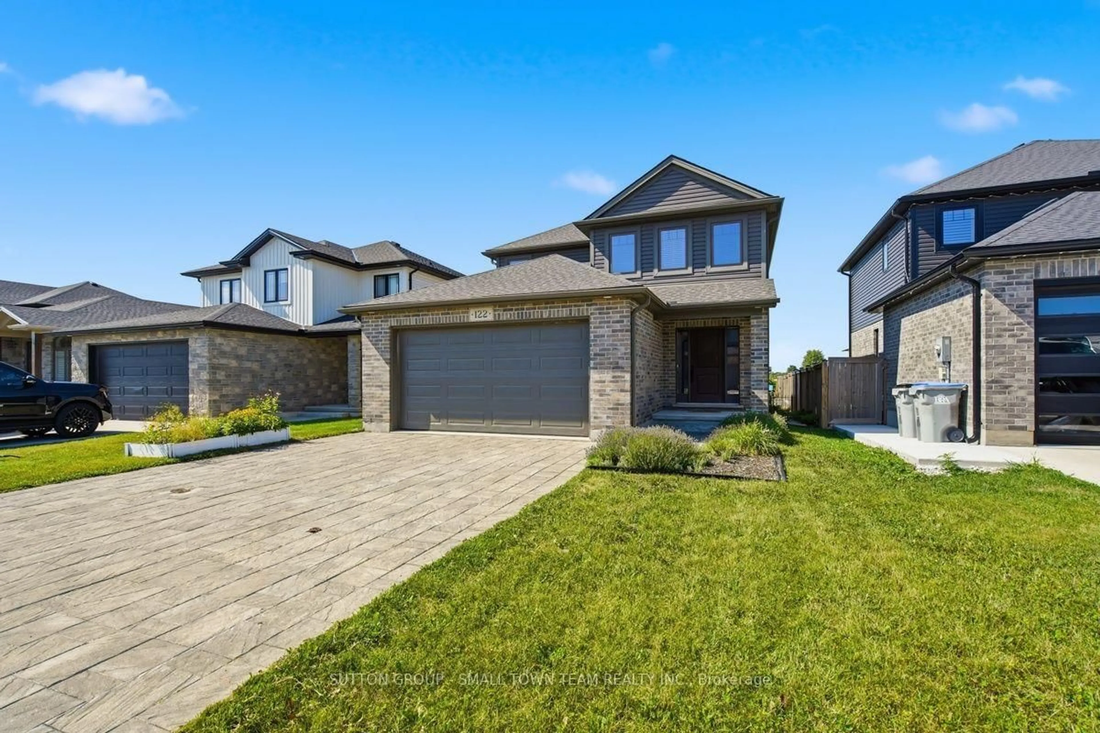 Home with brick exterior material, street for 122 Gilmour Dr, Lucan Biddulph Ontario N0M 2J0