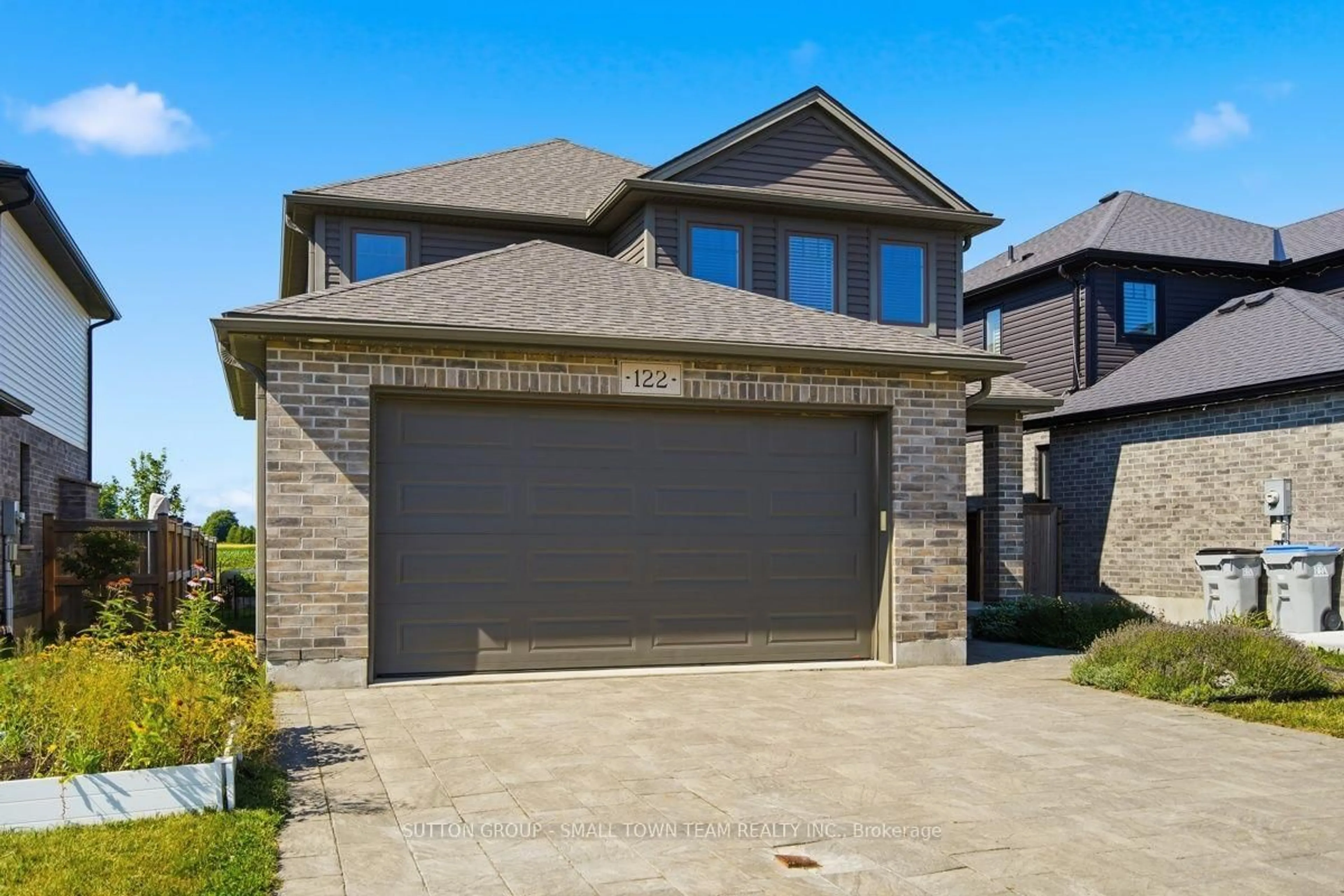 Home with brick exterior material, street for 122 Gilmour Dr, Lucan Biddulph Ontario N0M 2J0