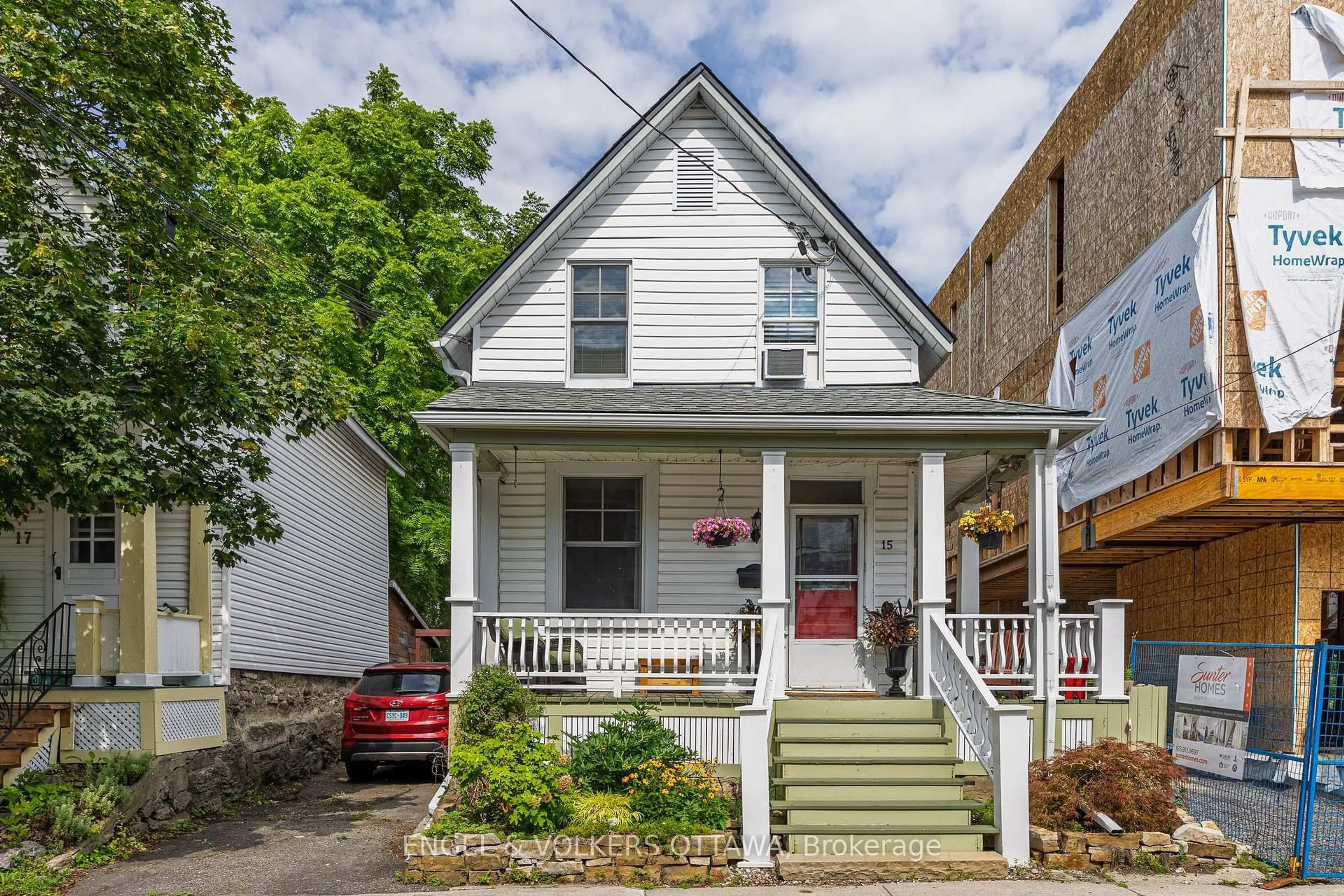 Home with vinyl exterior material, street for 15 Lowrey St, Ottawa Ontario K1Y 2S5