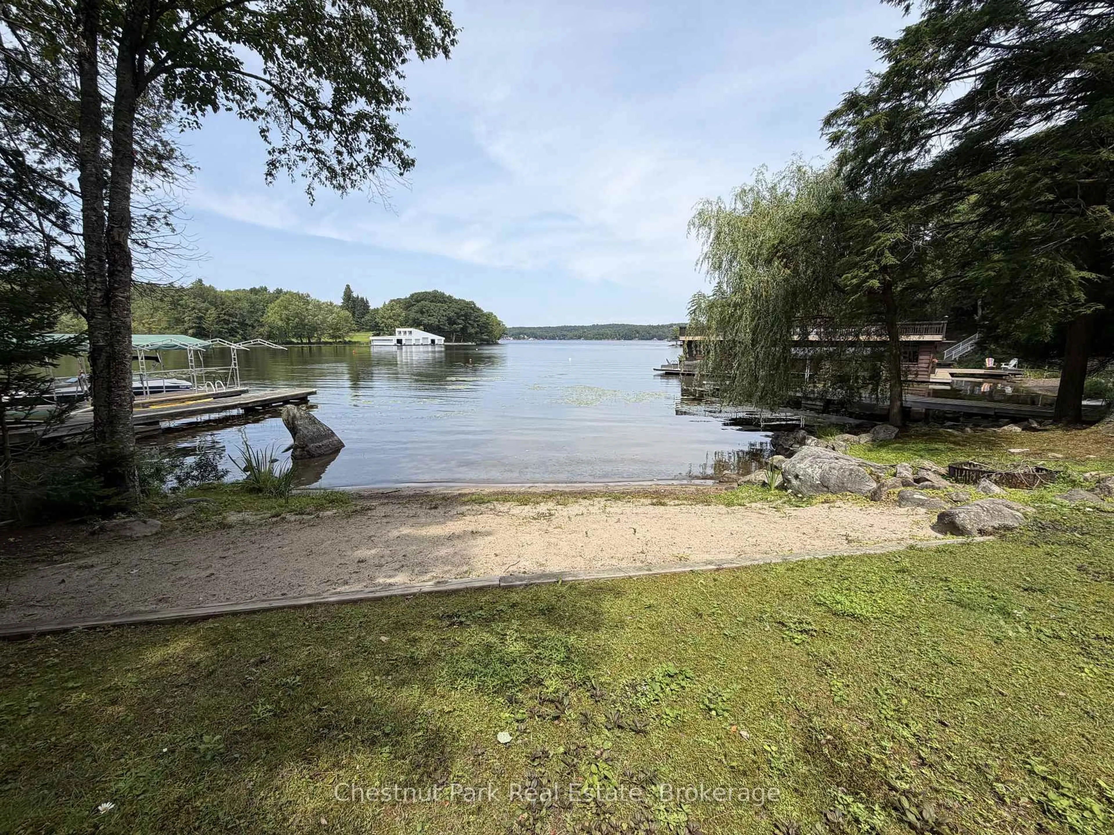 A pic from outside/outdoor area/front of a property/back of a property/a pic from drone, water/lake/river/ocean view for 1002 Ahmic Dr, Muskoka Lakes Ontario P0B 1G0