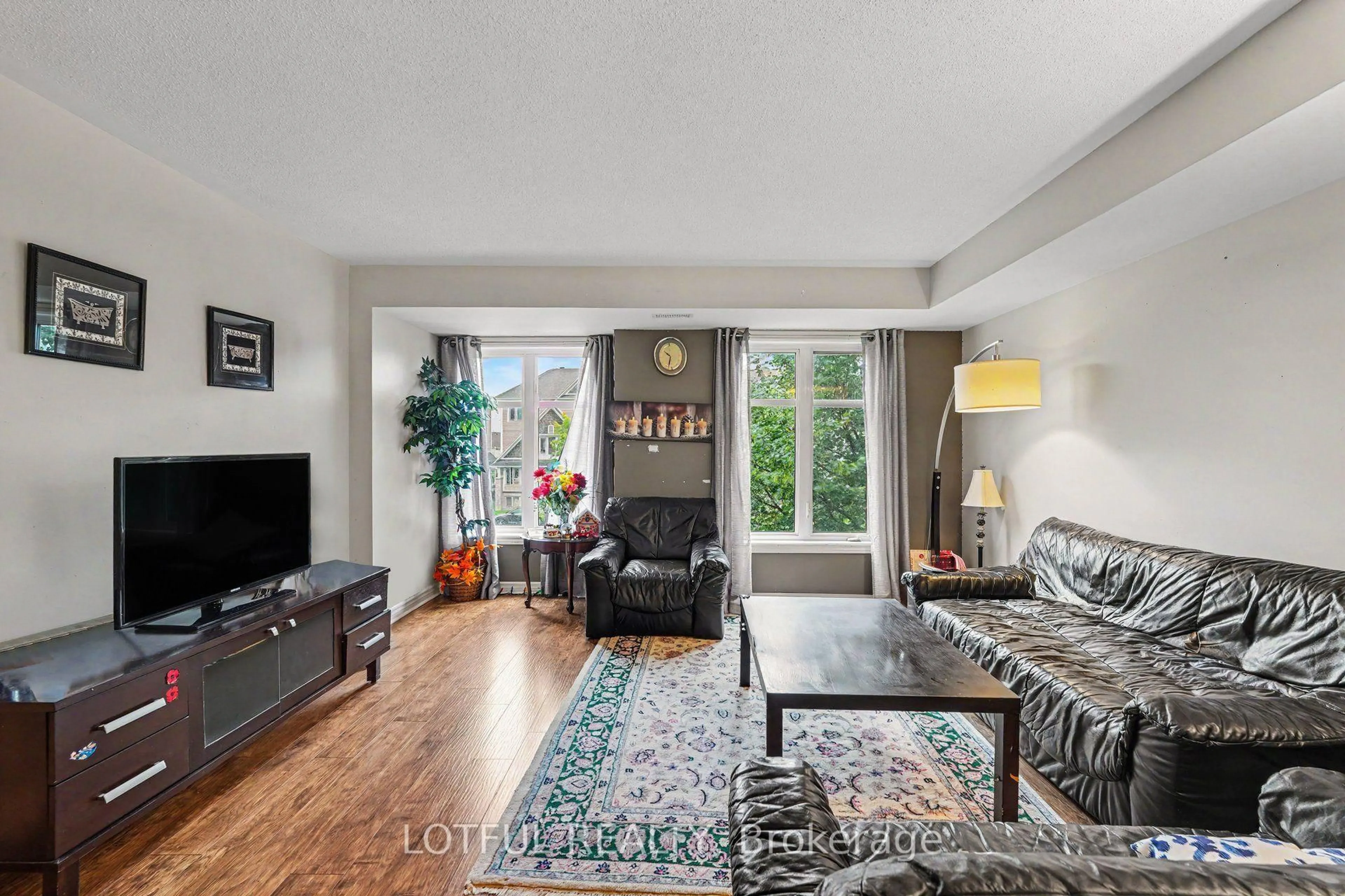 Living room with furniture, unknown for 585 Chapman Mills Dr #20, Ottawa Ontario K2J 5T1
