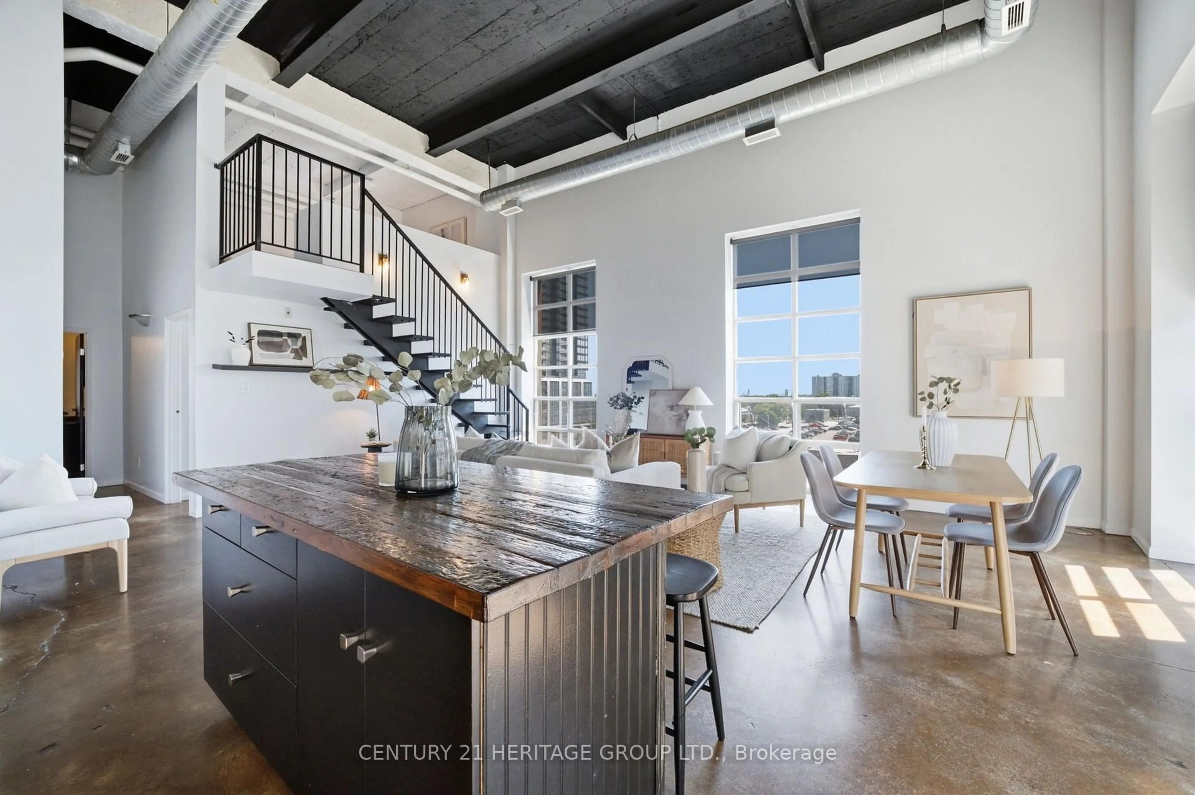 Open concept kitchen, cement floor for 11 Rebecca St #410, Hamilton Ontario L8R 3H7